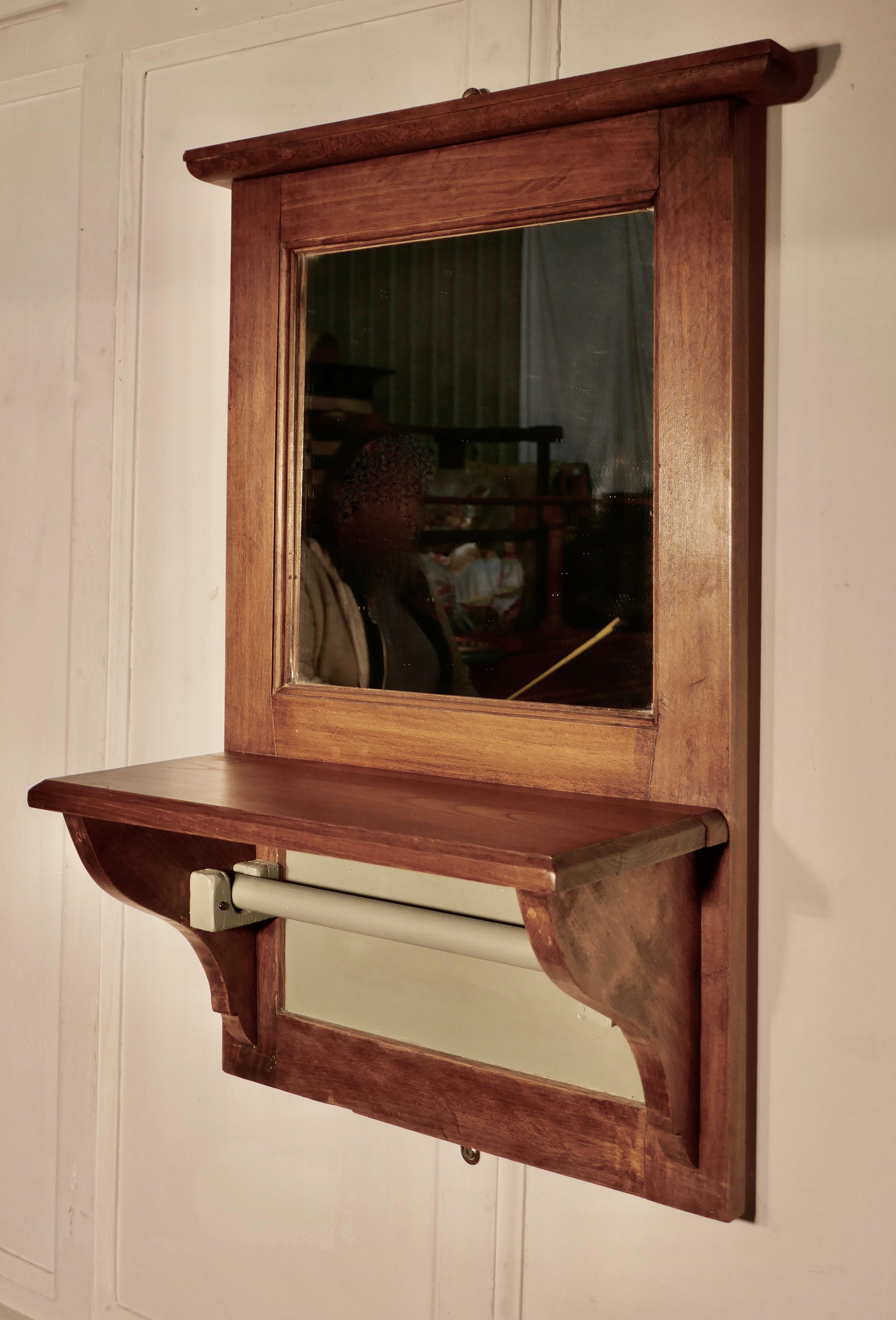 19th century French walnut cloakroom wall mirror with towel rail

This is a very useful piece, the mirror has a small shelf under which there is a towel hanging rail and a painted panel
The mirror and frame are both in good condition
The mirror