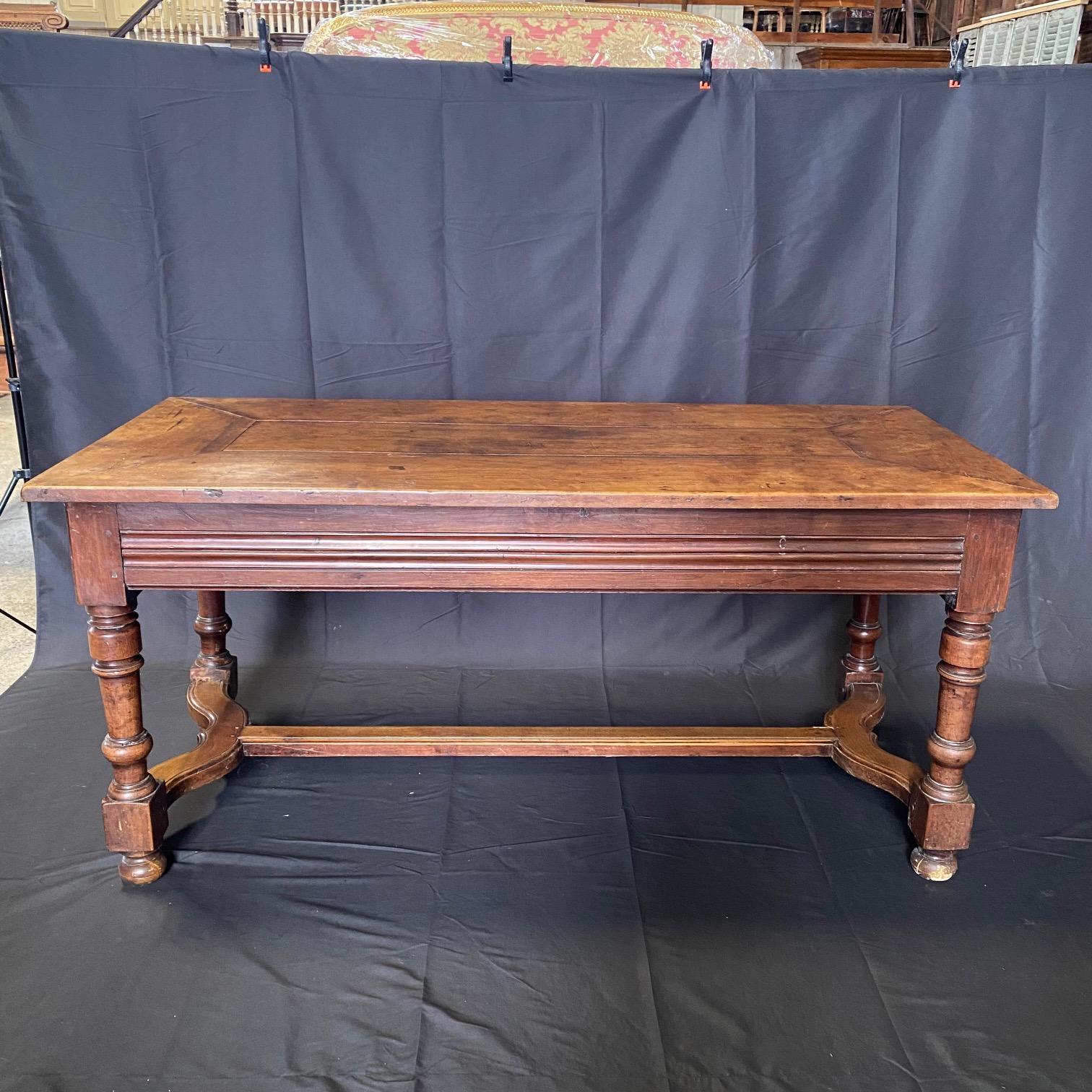 Antique Country French dining table was found in Avignon, France and is a great medium size - can serve as a dining table or impressive desk! The top is lovely; fashioned from five expertly joined solid planks of old-growth walnut to last for
