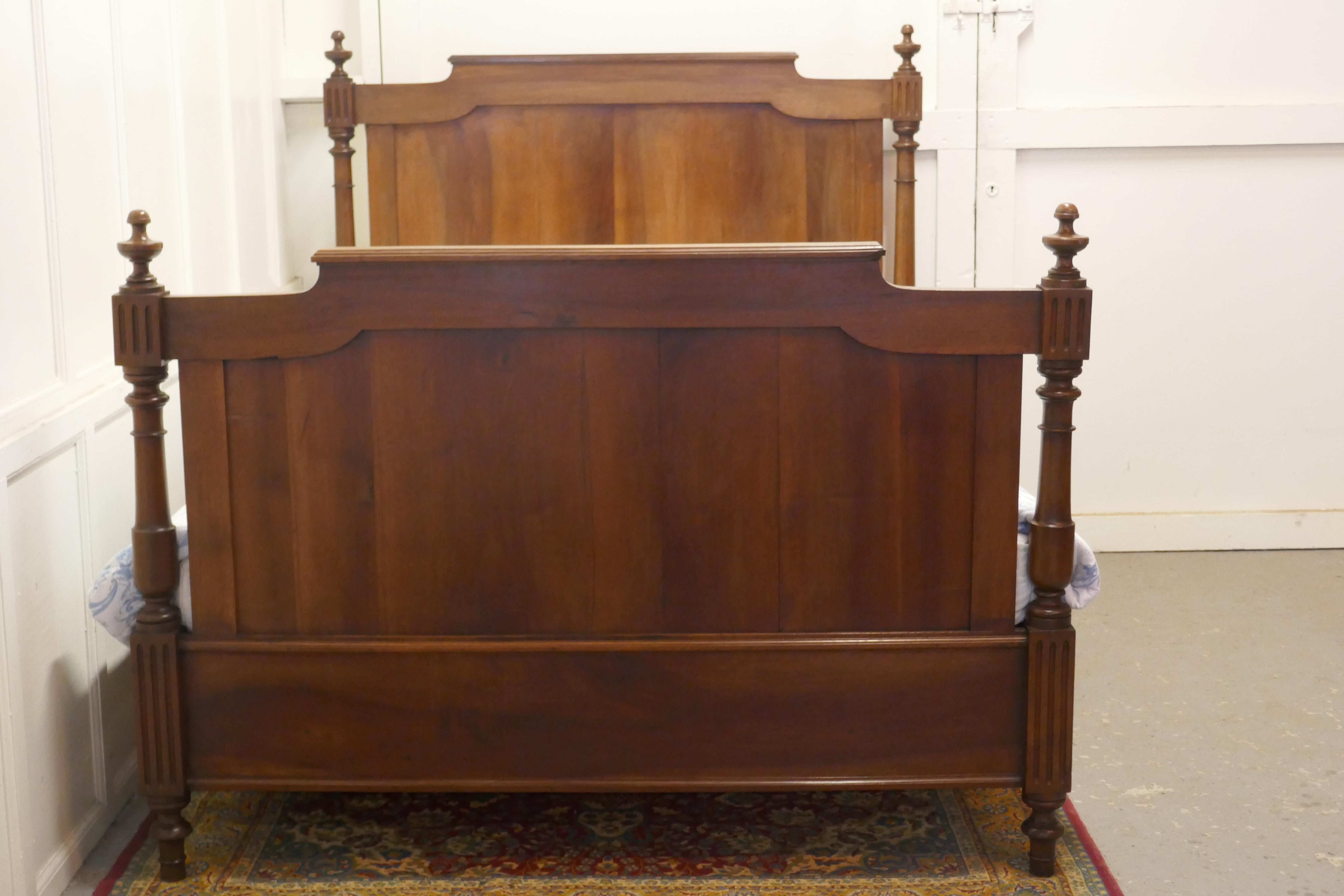 19th century French walnut double bed

This is a charming plain panelled French Walnut bed, it has turned finials at both ends and deep sides
The bed is in good condition and the patina of the walnut shines through
The bed can be used by placing