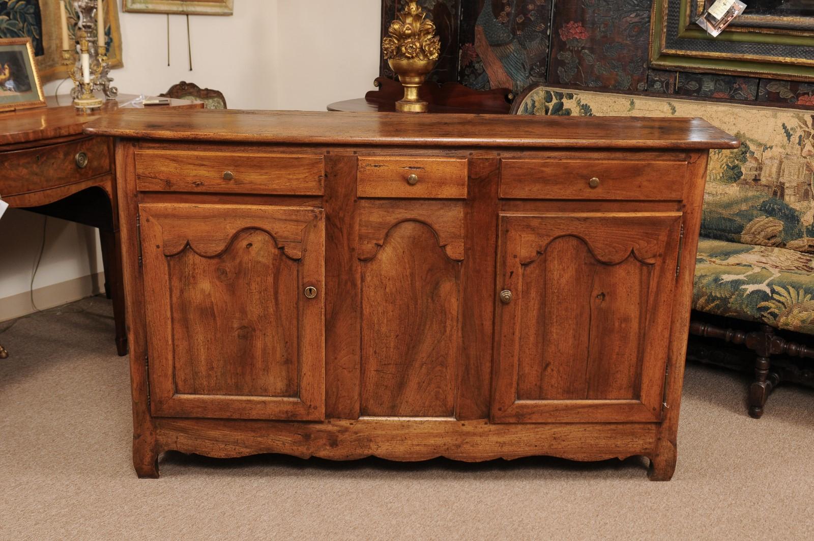 The 19th century, French walnut Enfilade of shallow size with 3 drawers, 2 paneled doors below and shaped apron. 

  