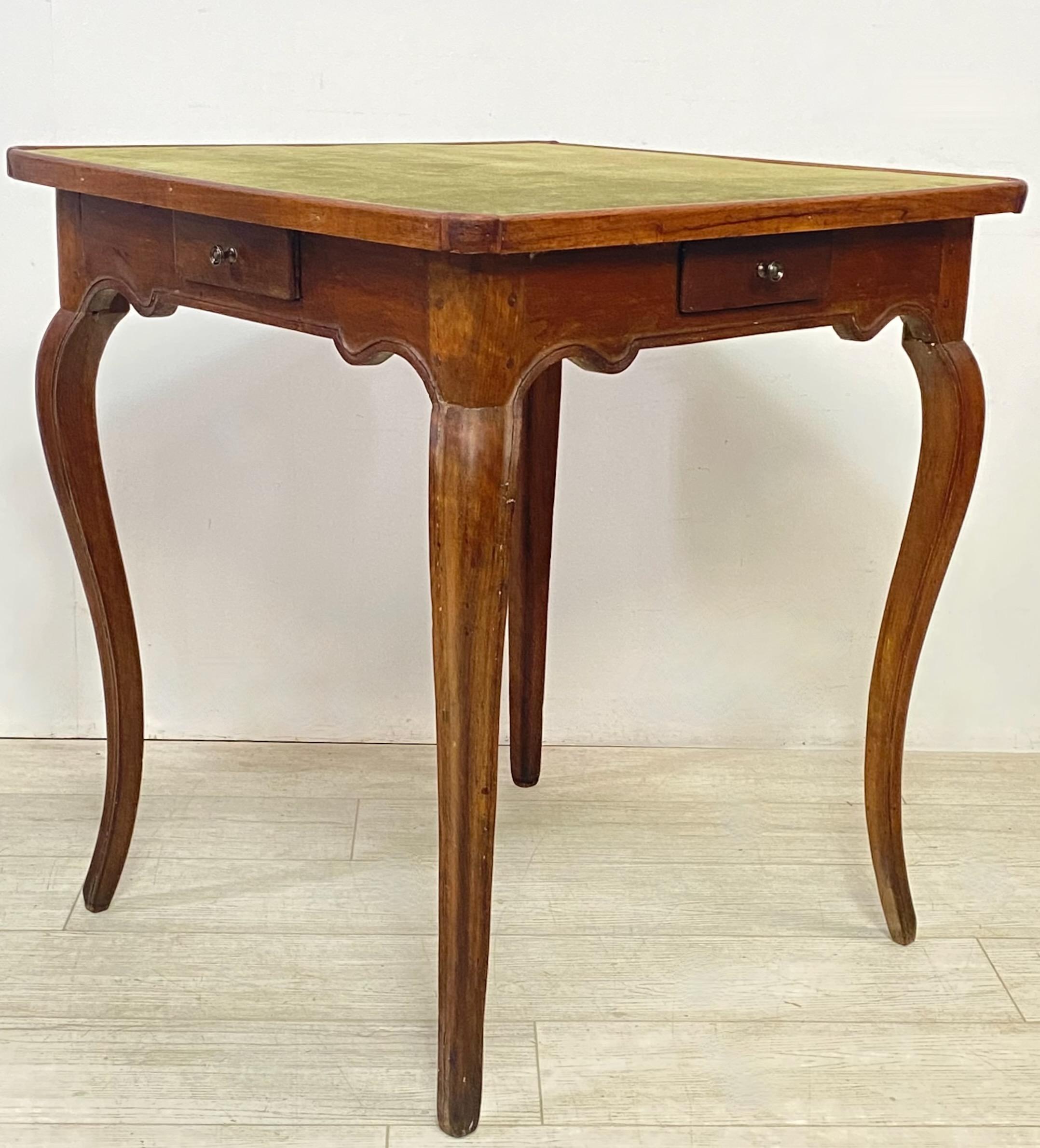 A completely hand crafted walnut game table in the 18th century form but likely made in the early to mid 19th century. Having a recently replaced suede leather table top surface. 
Beautiful simple elegant design. Sturdy and sound.
In excellent