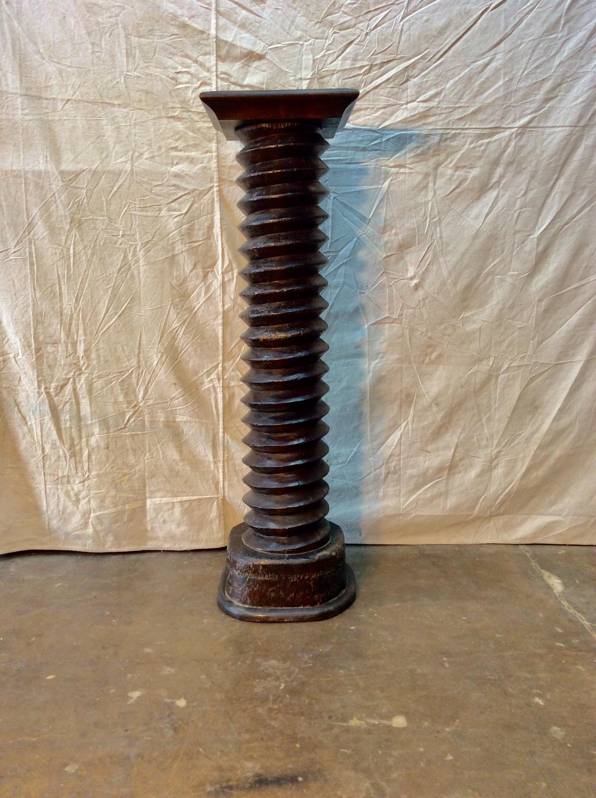 This wonderfully aged 19th century grape press screw was once used in a French winery. The shaft would have driven a large stone wheel downward, crushing and squeezing grapes, forcing out their juice as the stone rotated across them. The production