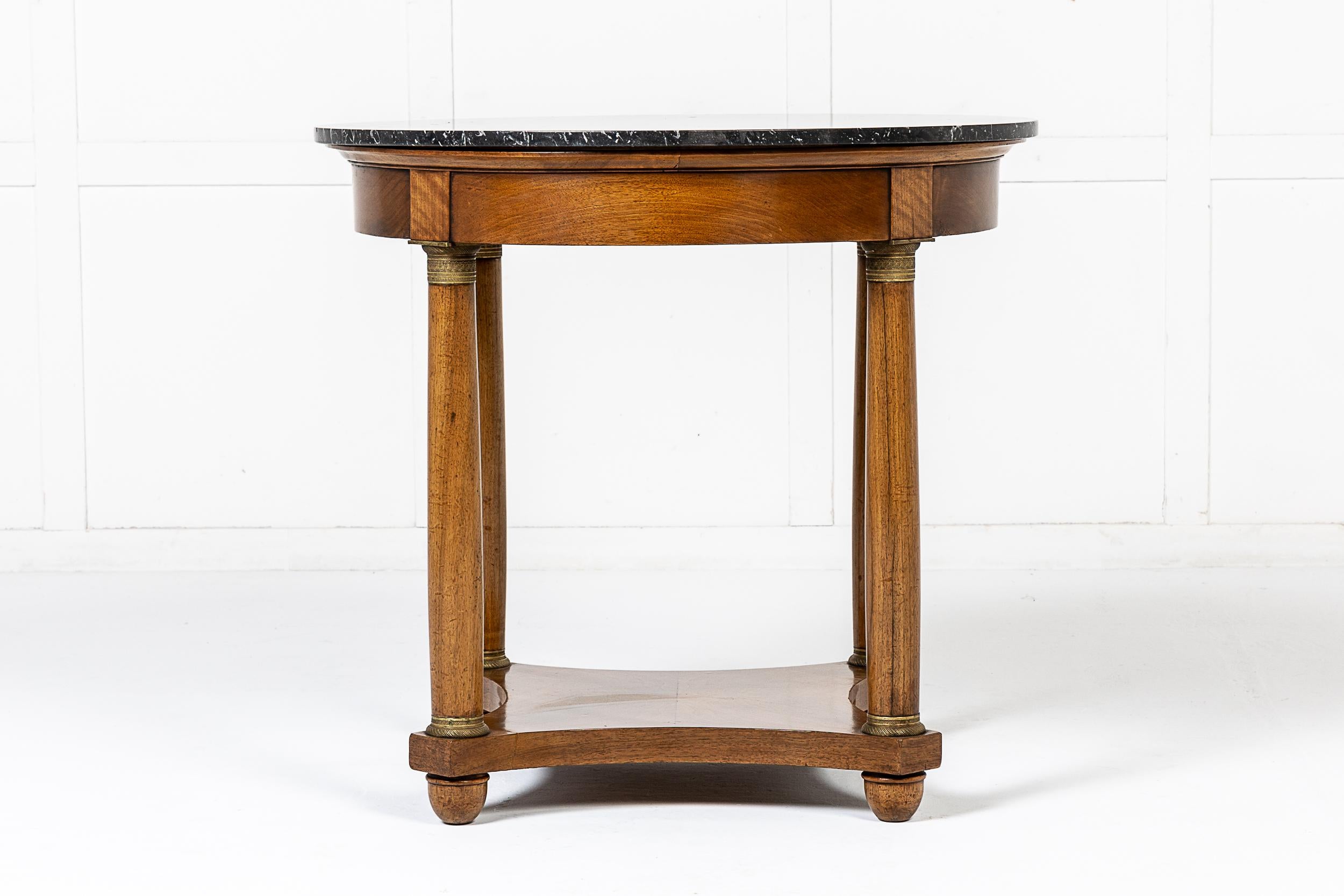 A Good Quality 19th Century French Walnut Guéridon with Original Marble Top and Ormolu Mounts.

The walnut of fine mellow colour. The legs joined by a low stretcher or undertier and each leg with a fine ormolu mount to the top and base. The original