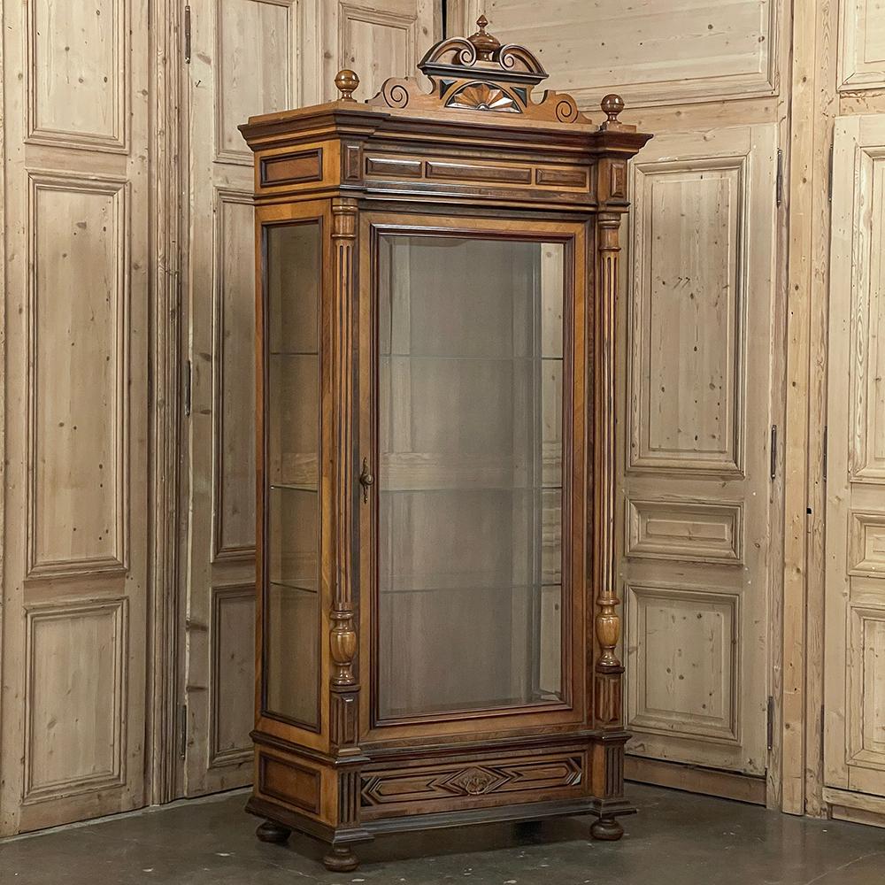 19th Century French Walnut Henri II Bookcase ~ Display Armoire is a splendid example of one of the classic French styles revived during the reign of the country's last monarch, Napoleon III.  Rendered from highly prized blonde walnut, it features a