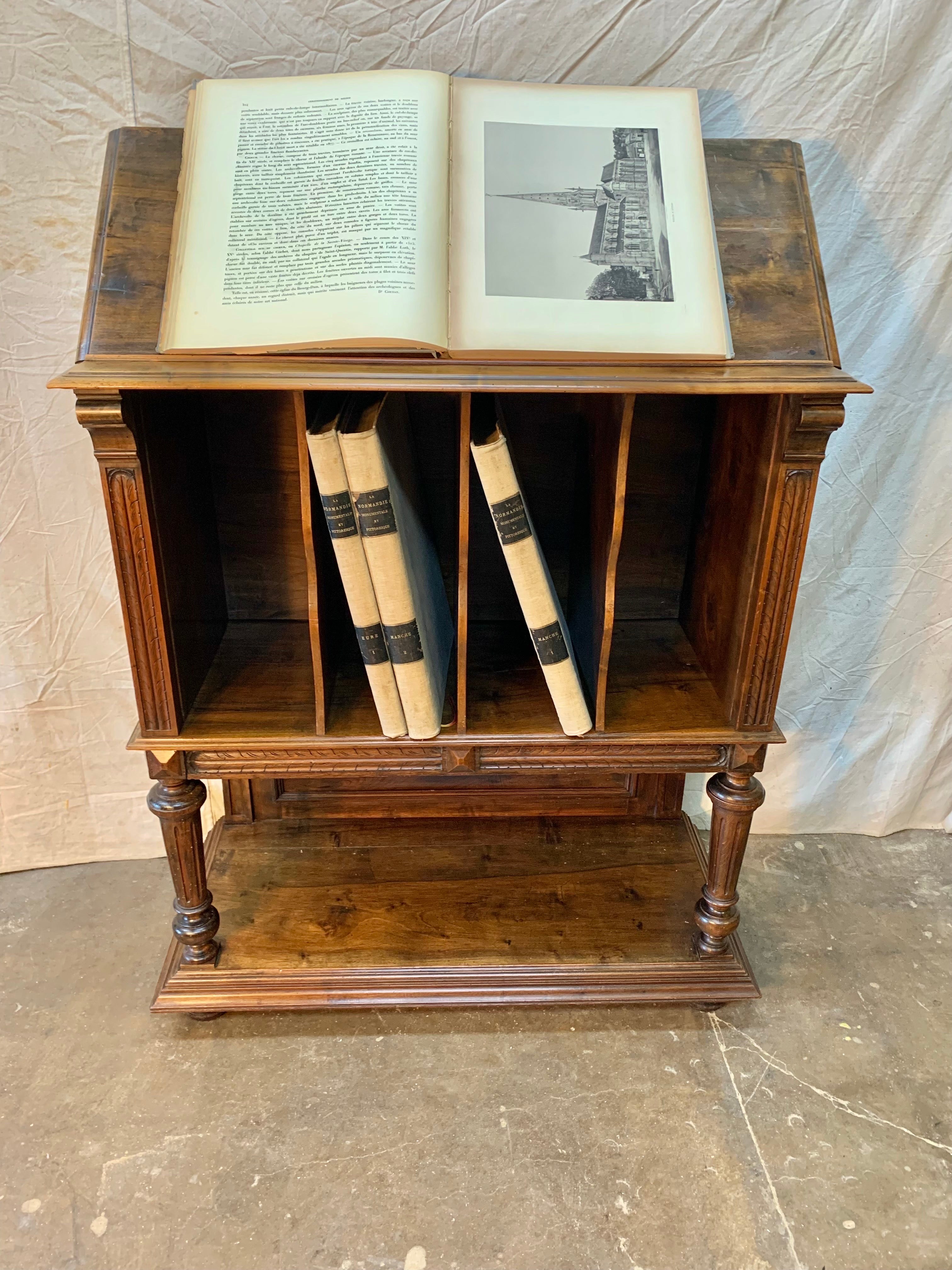 Found in the South of France, this 19th Century French Book Stand was once used in the library of a French Chateau.  Uniquely crafted from old growth walnut, the piece features a lectern top that can be adjusted to different angle heights, which