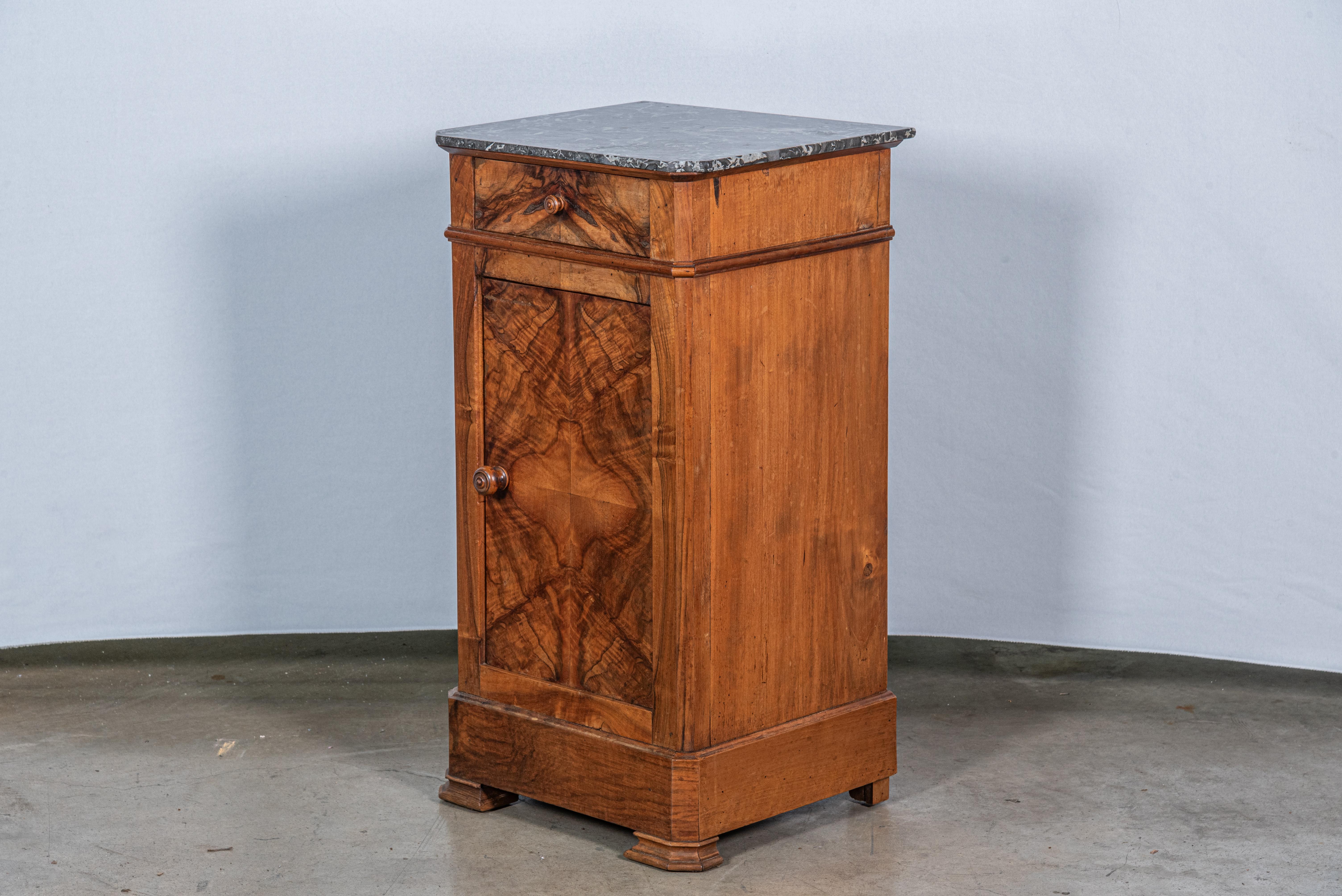 Discover timeless elegance with our 19th Century French Louis Philippe Walnut Nightstand, boasting exquisite craftsmanship and classic design. Crafted from premium walnut wood and adorned with a lustrous walnut veneer, this nightstand exudes