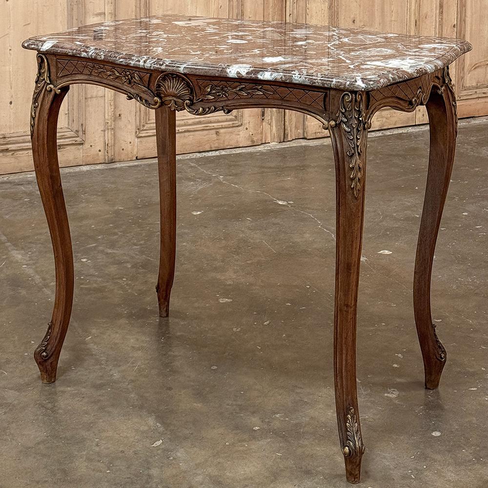 19th century French walnut Louis XV marble top end table reminds us why the French are considered at the top furniture crafters in the world! Sculpting sumptuous French walnut into naturalistic shapes, they created gracefully scrolled cabriole legs