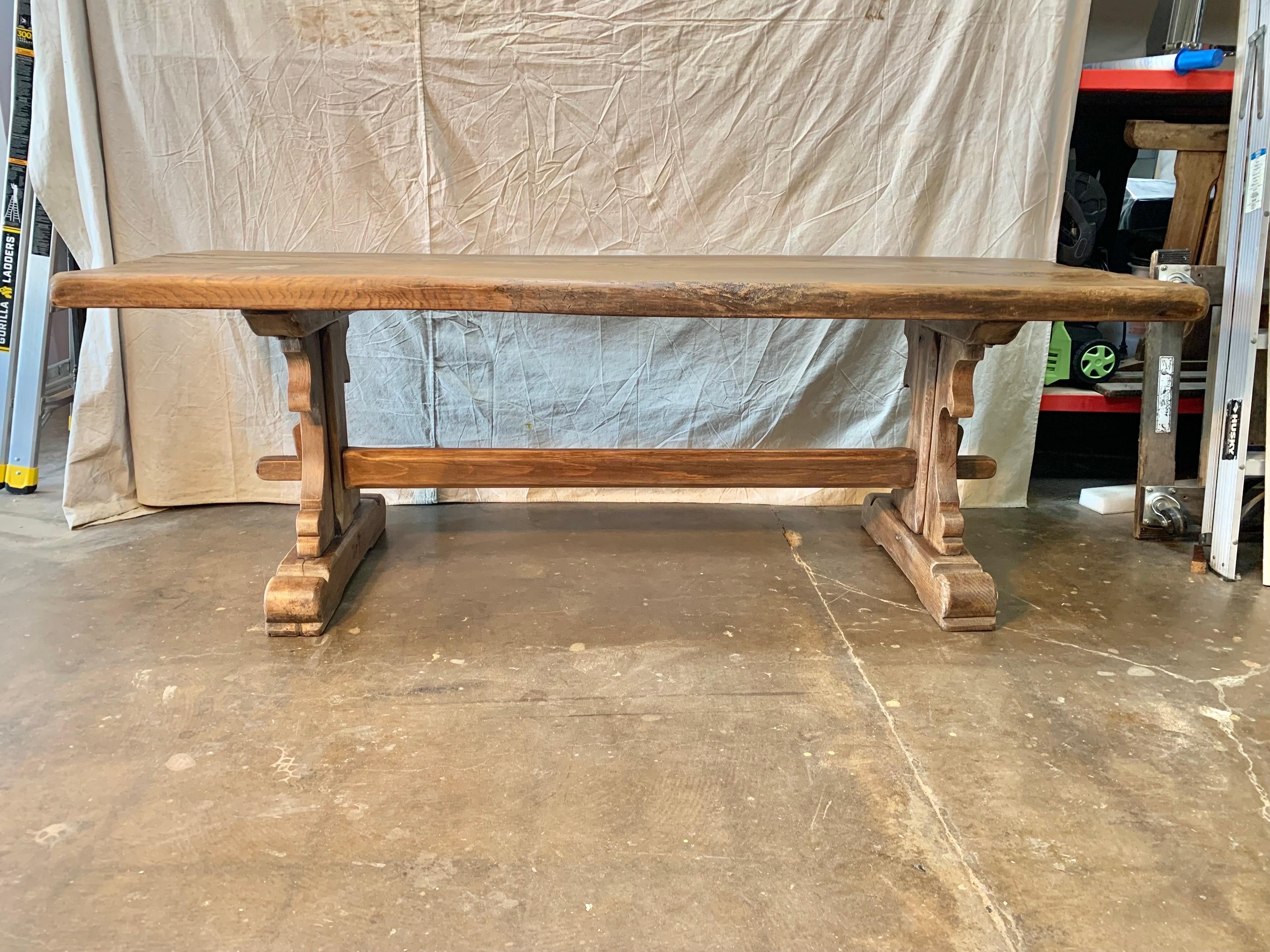 Found in the South of France this 19th Century French Walnut Monastery Dining Table features a 2.75