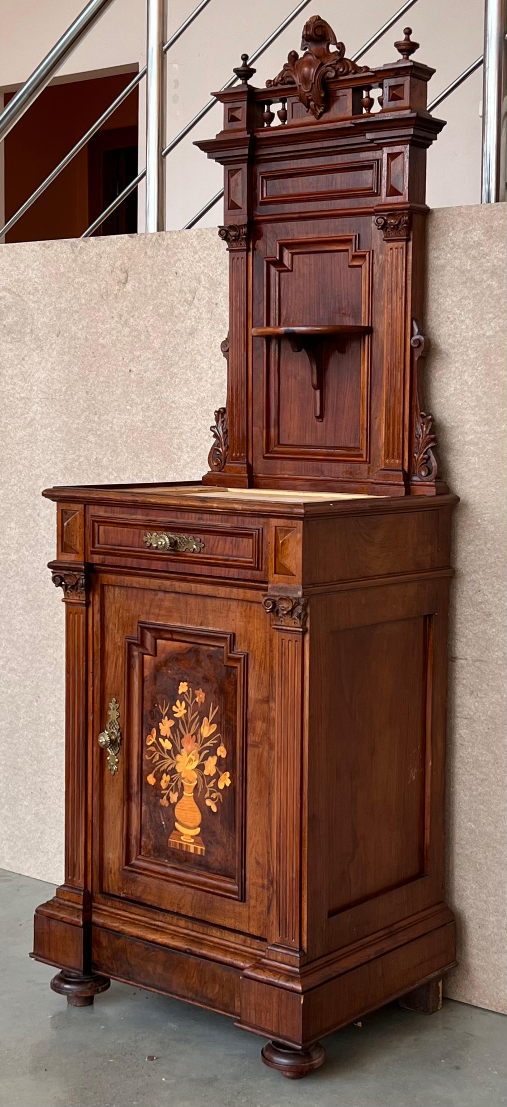 19th century French walnut neoclassical file cabinet is truly an unusual find! Appearing to be, at first glance, a large nightstands, features a single exterior drawer above a cabinet that opens to reveal an interior ceramic compartment. The