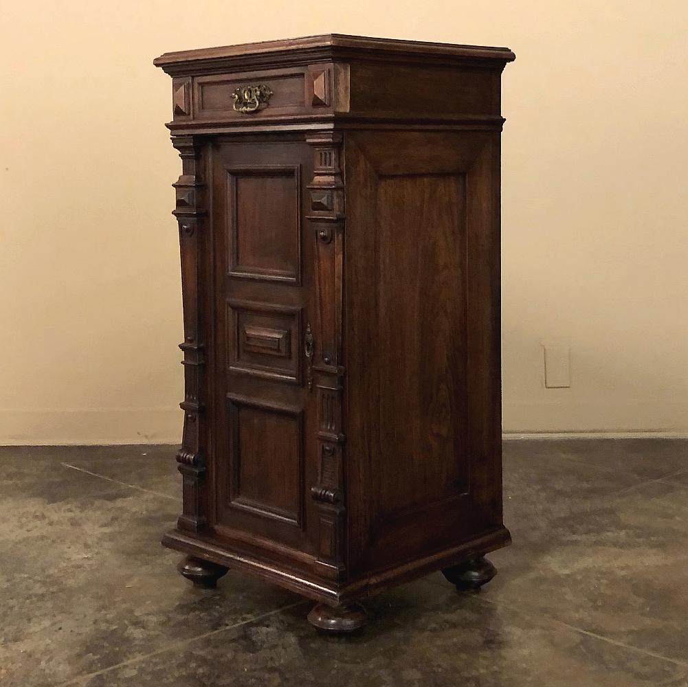 19th century French walnut neoclassical petit file cabinet is truly an unusual find! Appearing to be, at first glance, a large nightstand, it is in fact much larger at typical buffet height, and features a single exterior drawer above a cabinet that