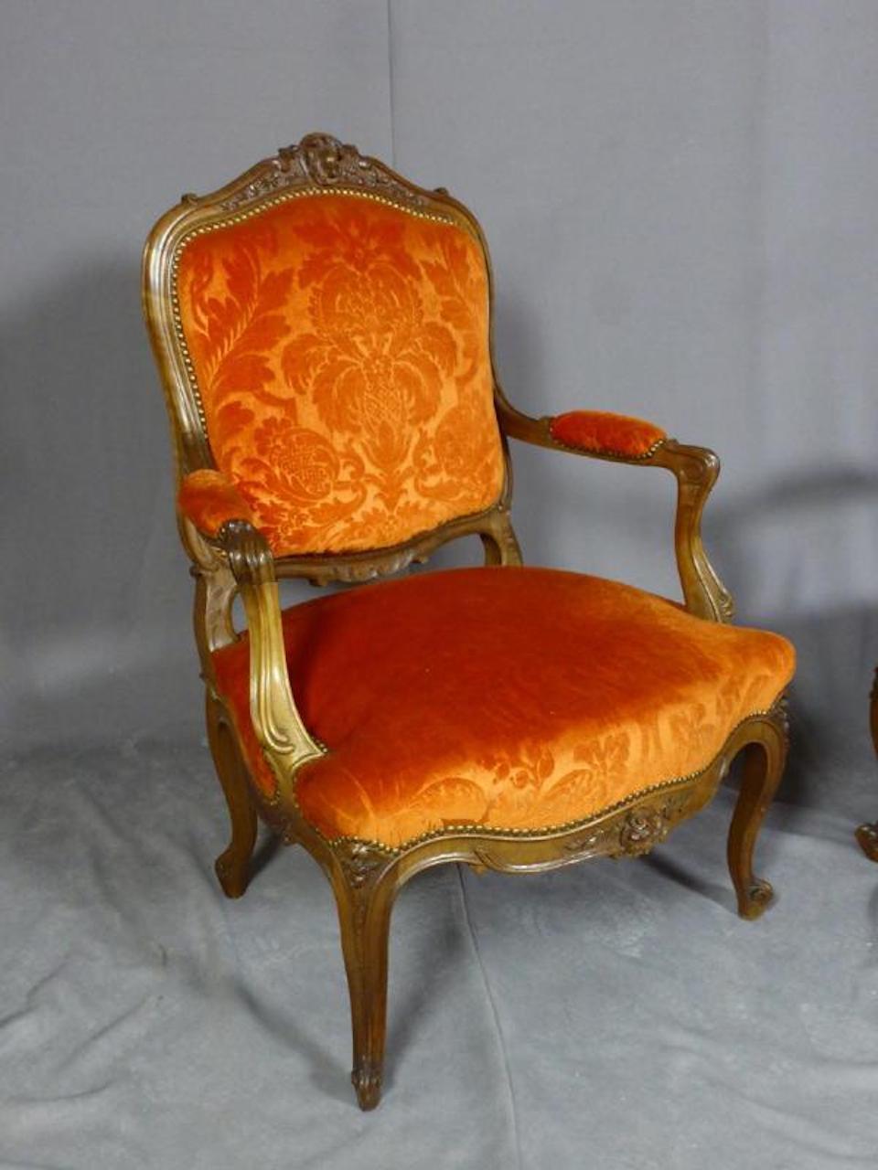 Embossed 19th Century French Walnut Pair of Louis XV Style Armchairs