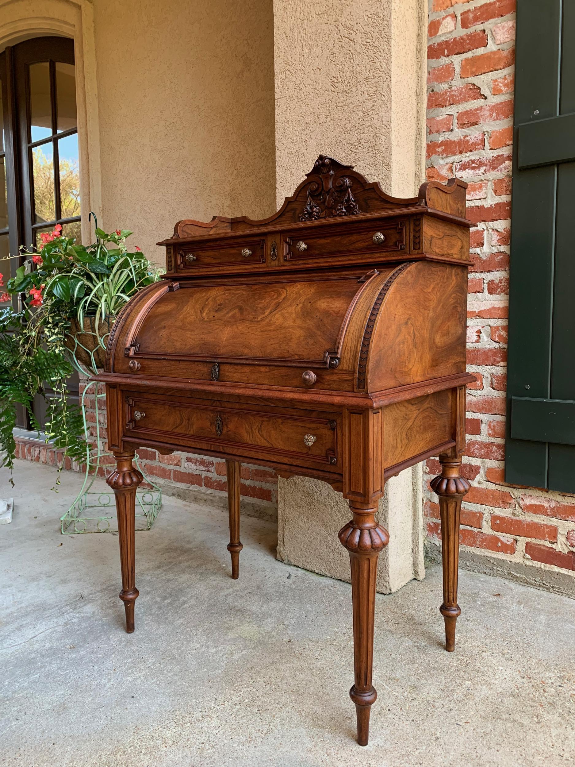 19th century French Walnut Roll Top Secretary Desk Henri II Biedermeier

~Direct from France~
~Beautiful antique French walnut secretary with fabulous detailing throughout and hints of Biedermeier style in the wood grains and interior