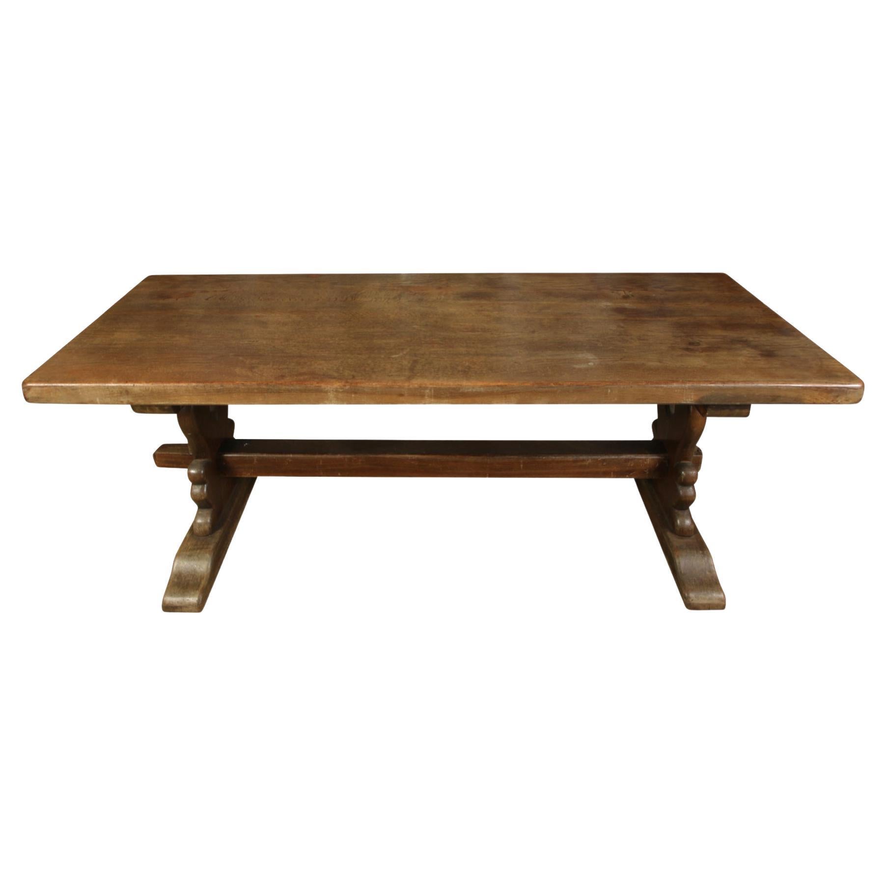 We love this piece for its wonderful color and patina. achieved only with the passage of time. This charming solid wood dining table on a trestle base seats six comfortably. Because of its versatile size, It would also serve as a console in an entry.