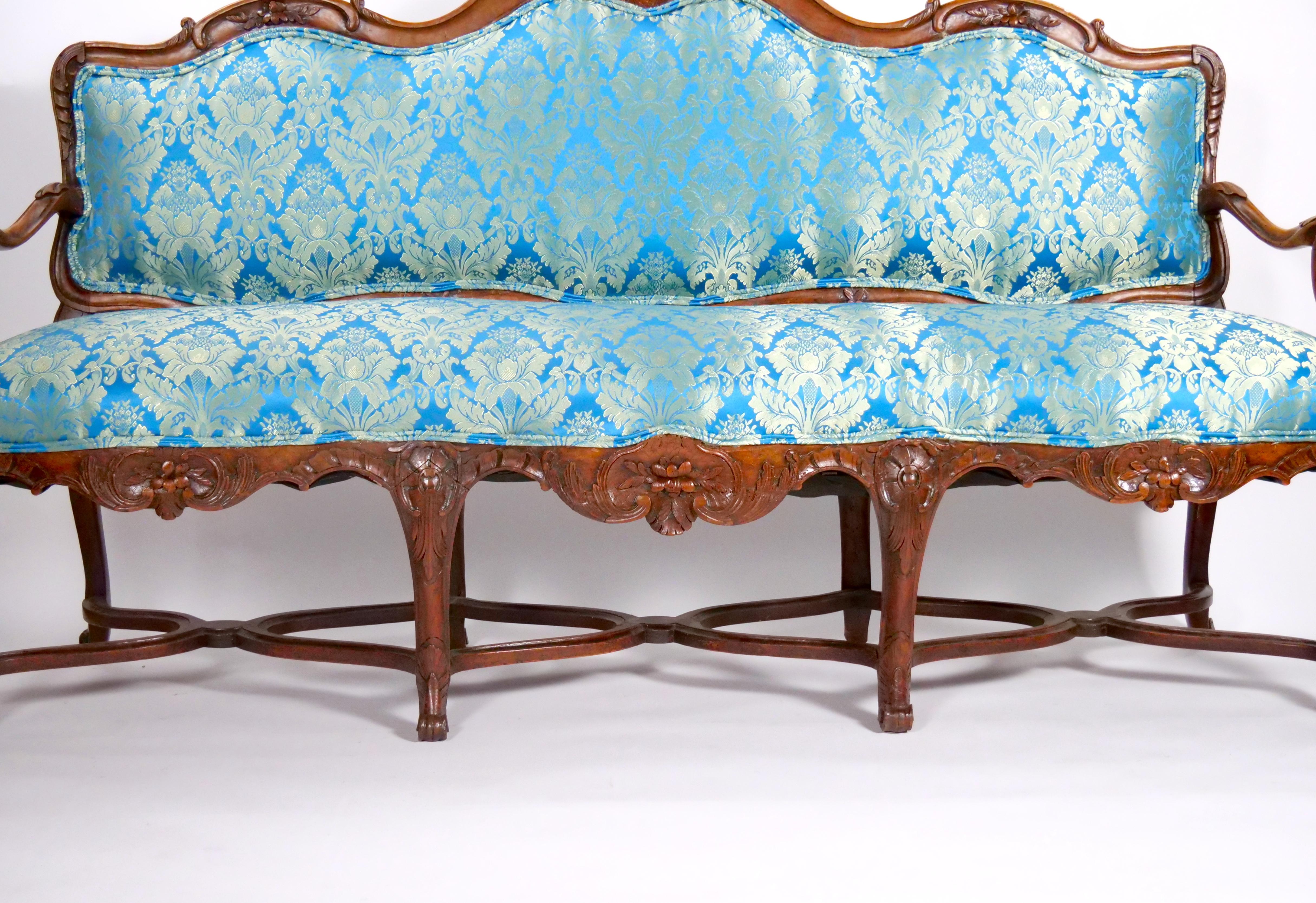 Hand-Carved 19th Century French Walnut Upholstered Three Seat Settee For Sale