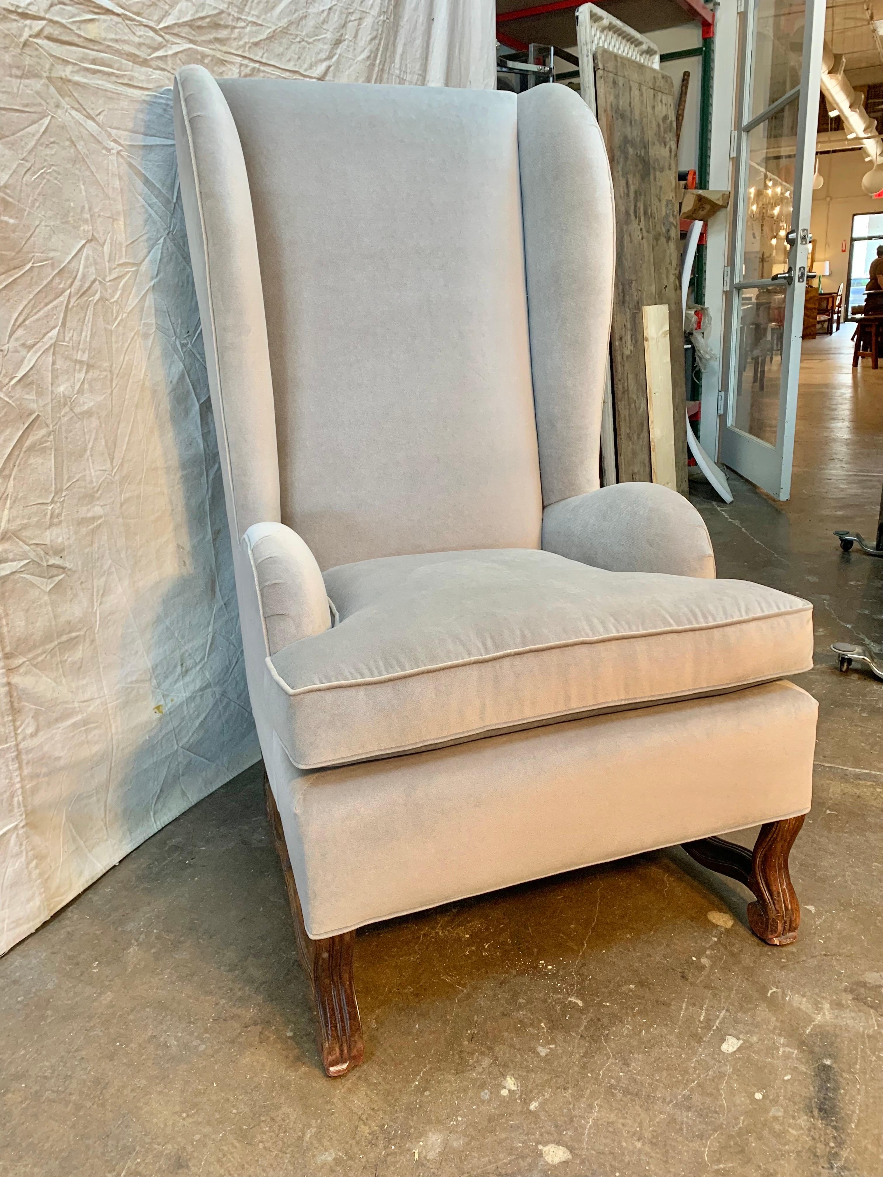 Found in the South of France this 19th Century French Wingback Chair features a walnut Os De Mouton Base and New Upholstery.  Created in France during the 19th century, the armchair features a wingback offering great privacy to the sitter and will