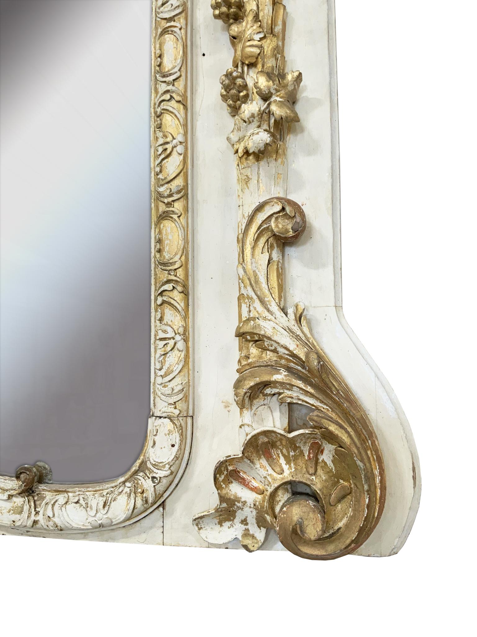 Stunning 19th century white/cream and gold mirror with gorgeous carving and gold embellishments.