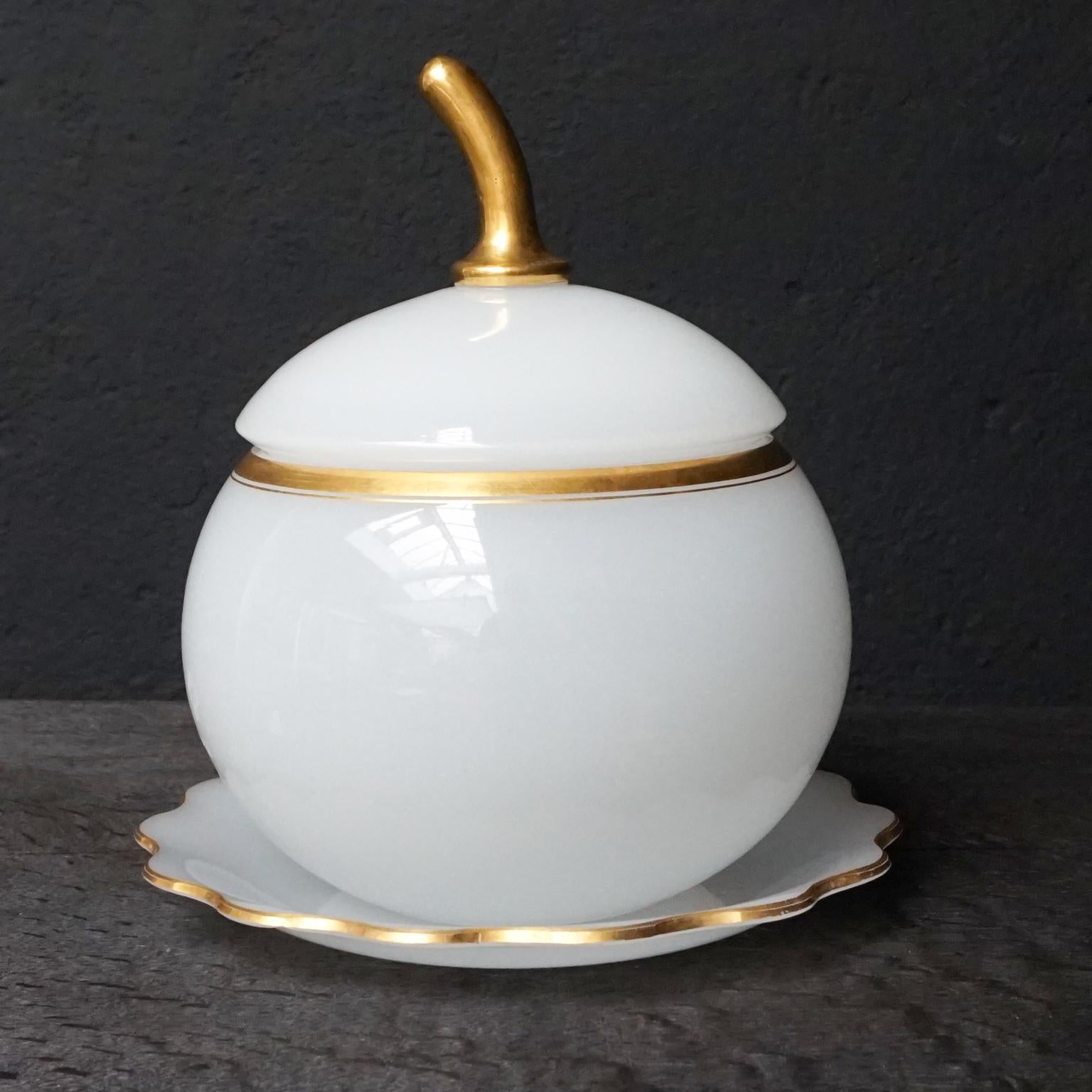 Large antique French white opaline glass bowl with gilded stem and gilt encircled decoration.
This pretty fruit-shaped tureen with cover comes with its original scalloped shaped plate.

Opaline glass is a decorative style of glass made in France