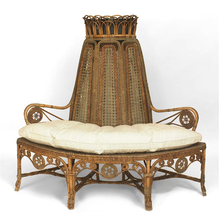 French Victorian natural wicker corner love seat with green & white wrapping and 3 high back panels supporting a planter with a stretcher & seat cushion (PERET & VIBERT) (Related items: 060664, 060665).
