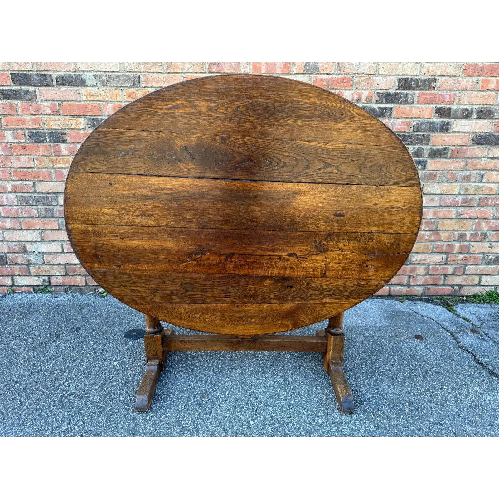 This 19th-century French wine table exudes timeless elegance, crafted with intricate detailing and deep rich wood. Its refined design and sturdy construction make it a perfect addition to any home, offering a touch of classic French charm. Elevate
