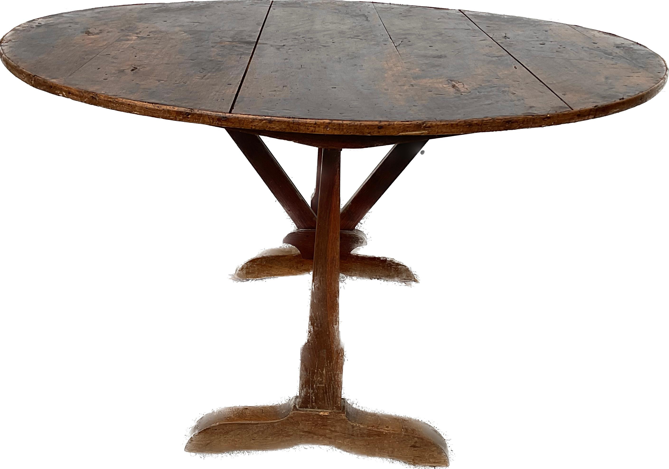 19th century Tilt-top French wine tasting table. The top can be positioned vertically for storage and opened for use as a side or dining table.