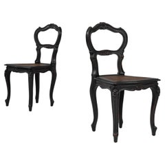 Antique 19th Century French Wood Black Patinated Chairs, a Pair