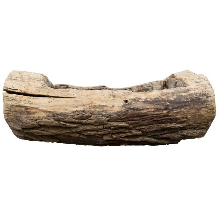 A dense and heavy single wood log from the French country side carved into a trough makes great use as a garden vessel for interiors and exteriors.