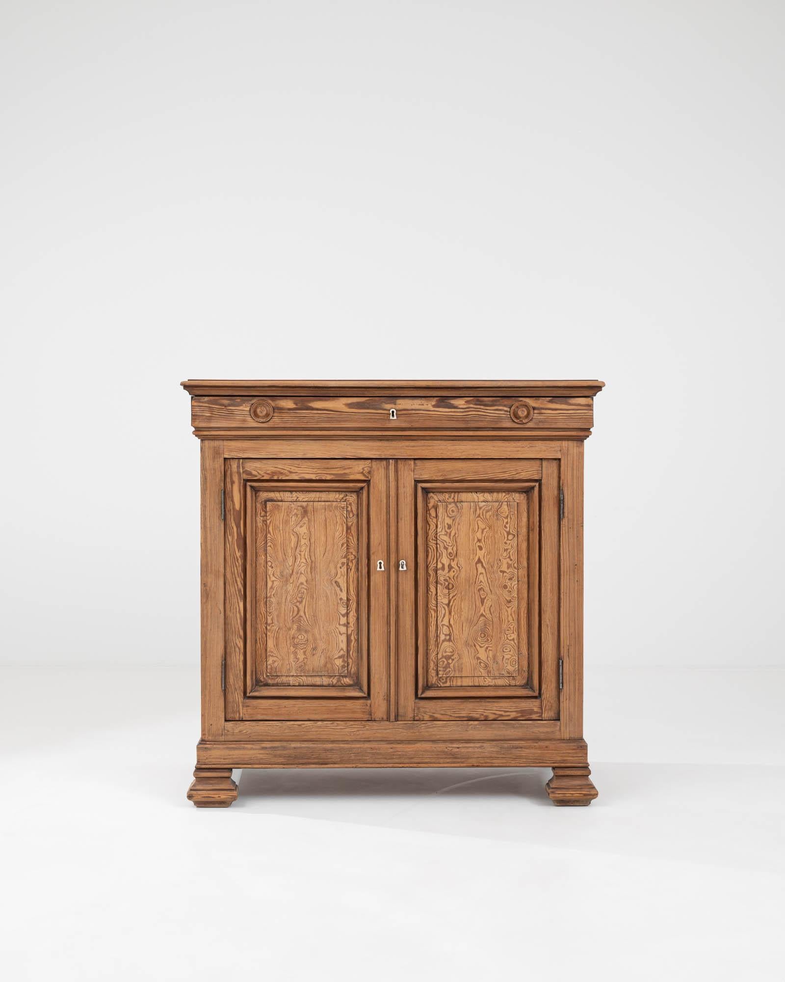 Introducing our exquisite 19th Century French Wooden Buffet, a testament to timeless elegance and functional design. Crafted with meticulous attention to detail, this stunning piece features a classic silhouette adorned with beautiful wood grain and