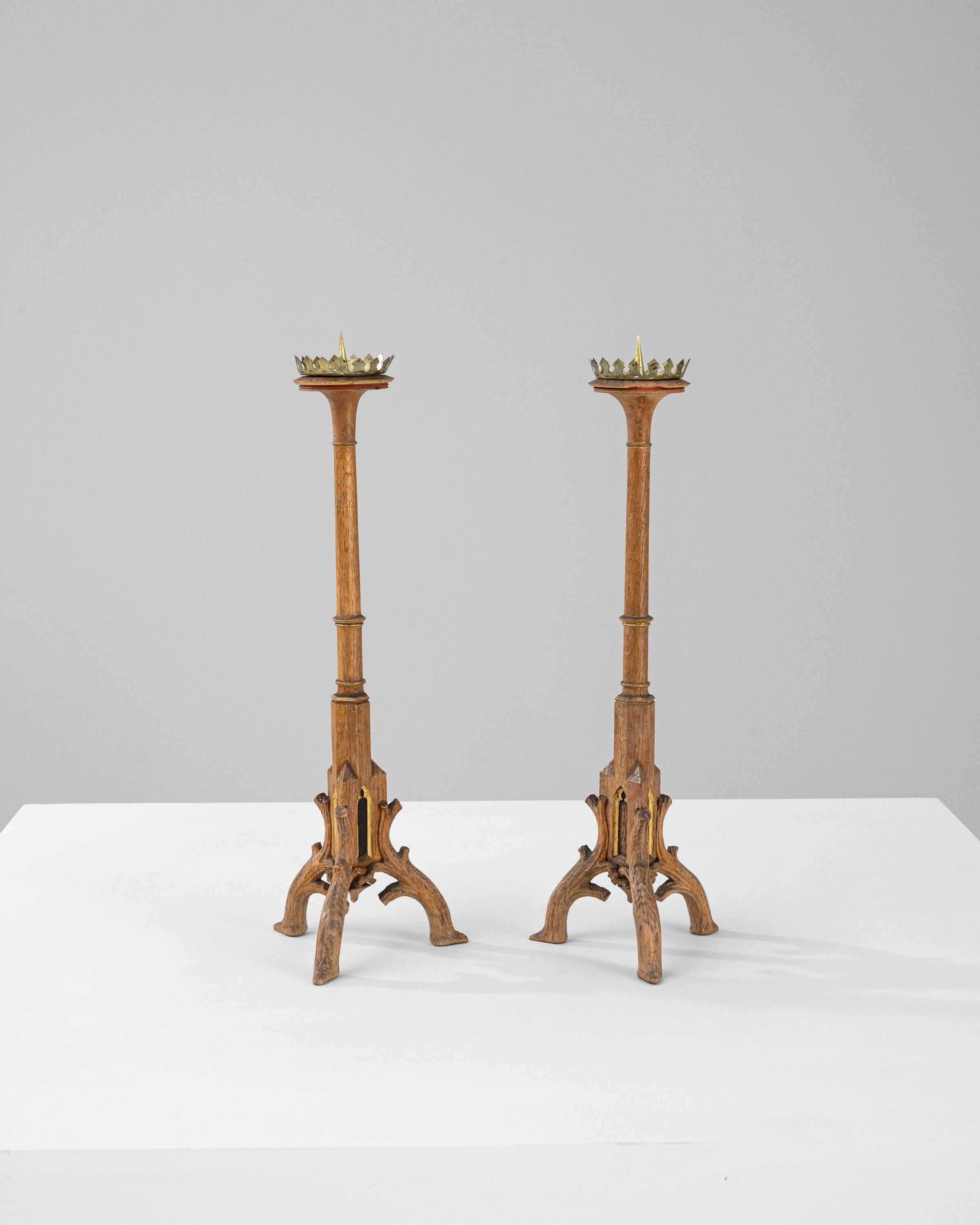 These 19th Century French Wooden Candlesticks exude a timeless grace, making them a splendid addition to any décor that appreciates antique charm. Each candlestick stands tall on an intricately carved wooden base, showcasing exquisite craftsmanship