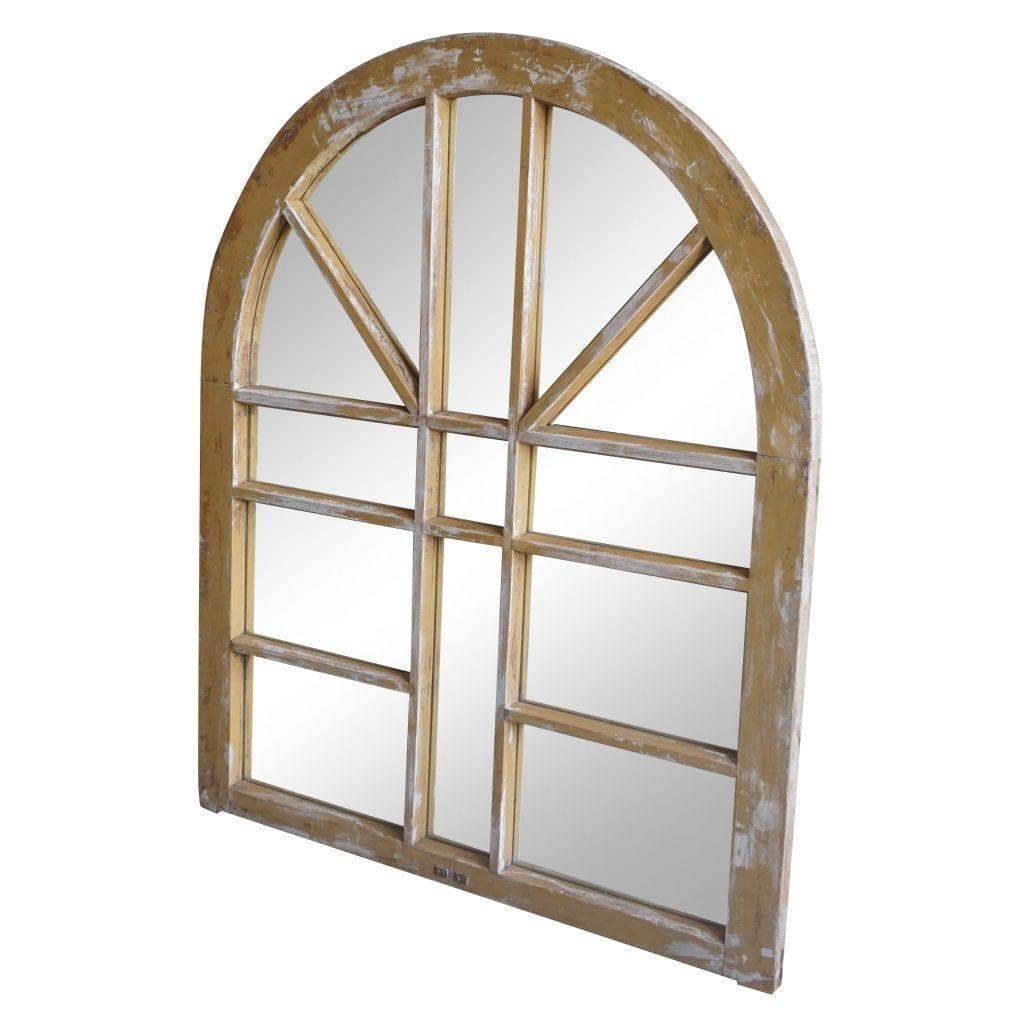 An antique French rustic Orangerie framed wall mirror with an arched sunburst top in wood, original mirror glass in good condition. Minor fading, due to age. Wear consistent with age and use, circa 1880, Marseilles, France.