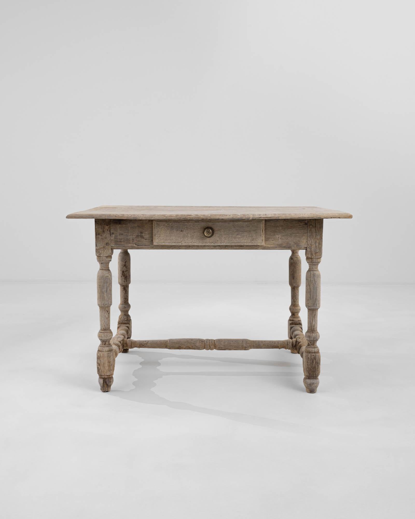 Transport yourself to the refined elegance of 19th century France with this exquisite wooden side table. Crafted with an artful and engaging design, this small yet captivating piece quietly commands attention, making a grand aesthetic statement in