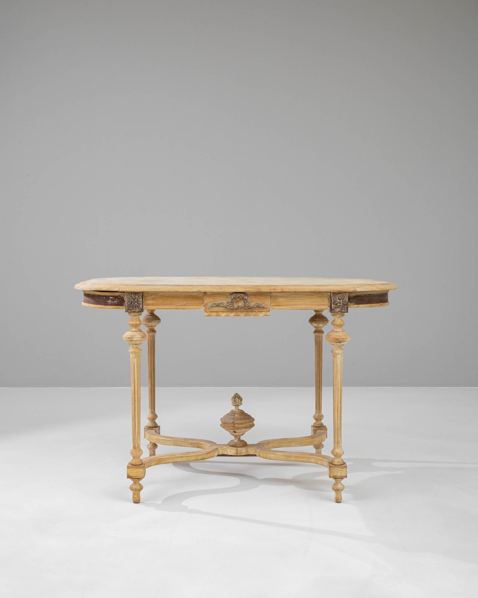 Elevate your home with a touch of timeless elegance with this exquisite 19th-century French wooden table. Crafted during a period renowned for its refined aesthetics, this table features a beautifully weathered surface and ornate carvings that