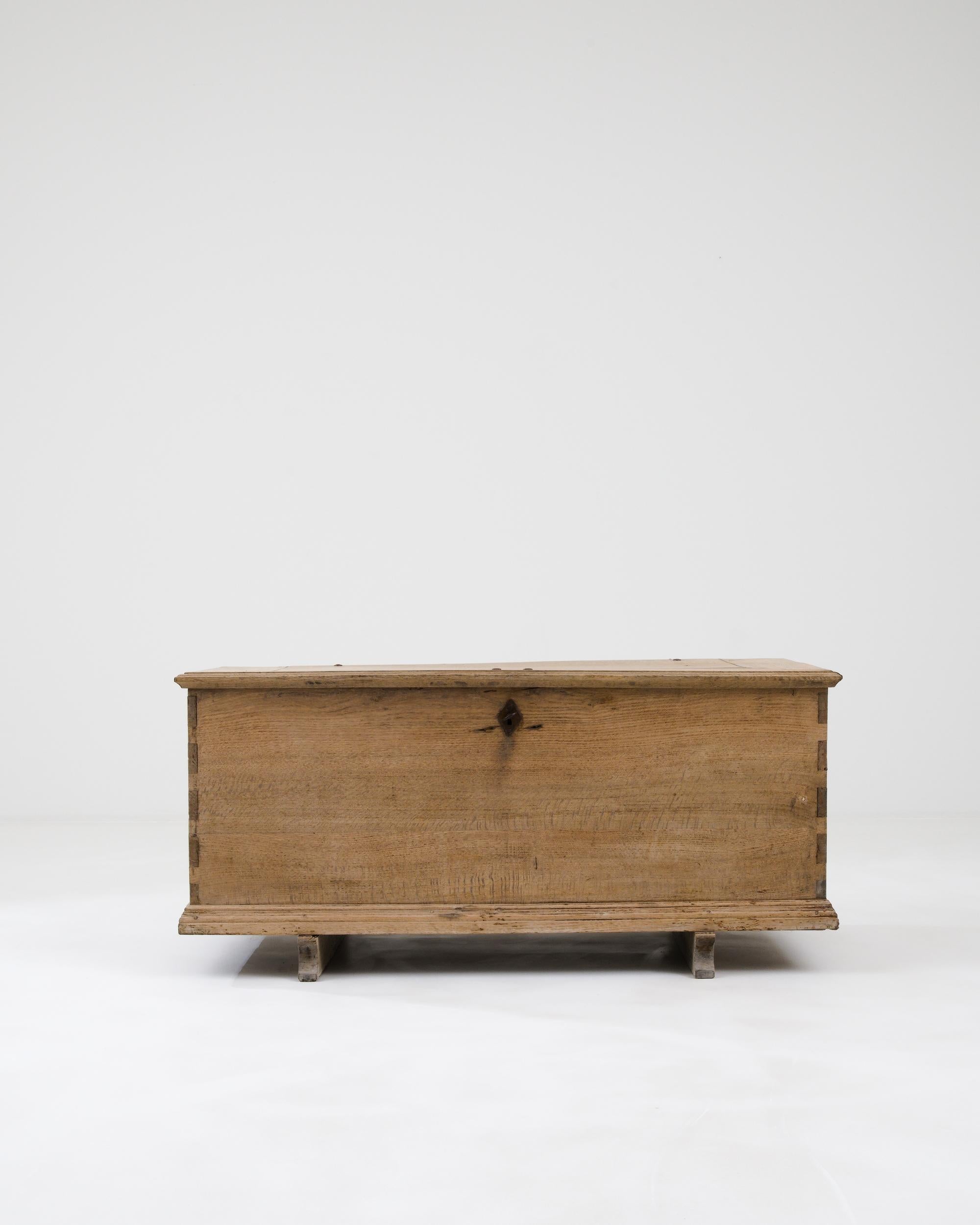 A wooden trunk created in 19th century France. A reminder of simple times, this wooden trunk shines with a bright and refreshing glow. The surface of the oak has been carefully restored through a bleaching process which both protects the material
