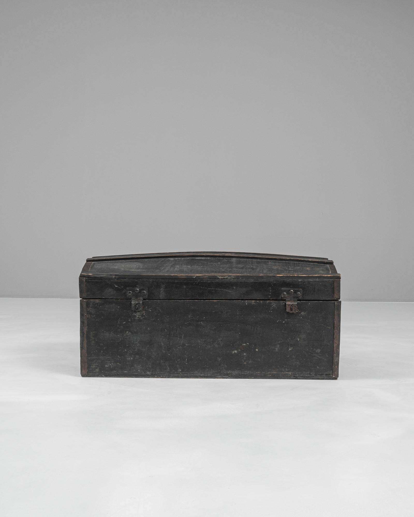 Discover timeless storage with this 19th Century French Wooden Trunk, a piece steeped in history and rustic charm. Crafted from solid wood, this trunk features a sturdy construction and a beautifully aged patina, highlighting its authentic vintage