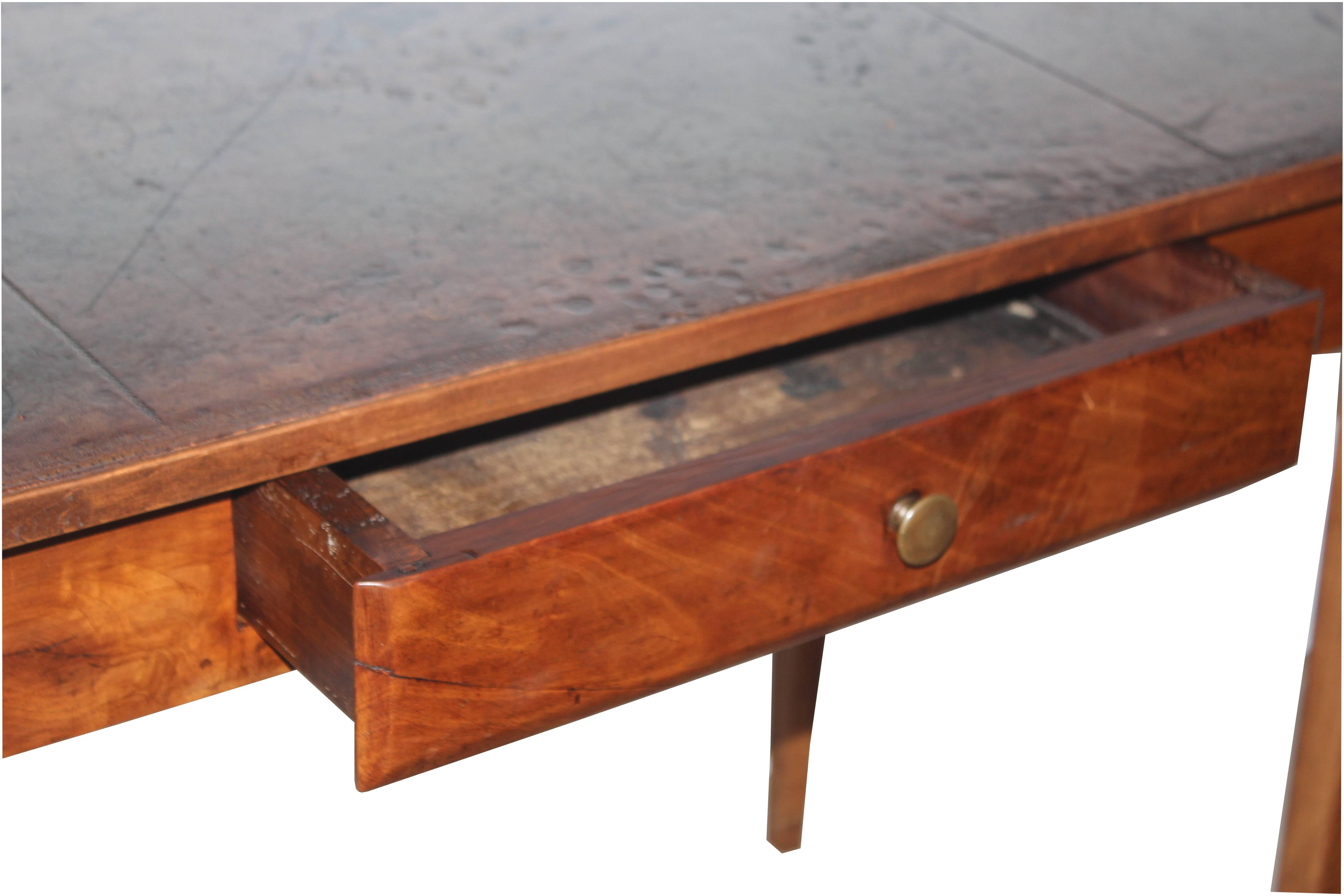 19th century leather top writing table with a single drawer.