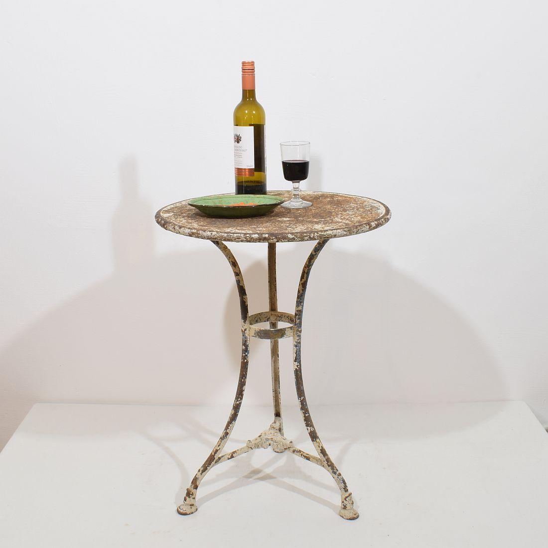 Wonderful antique Iron Arras bistro table / garden table, with riveted connections. The table top is original . Beautiful weathered patine 

France circa 1880
H:68cm  W:50,5cm