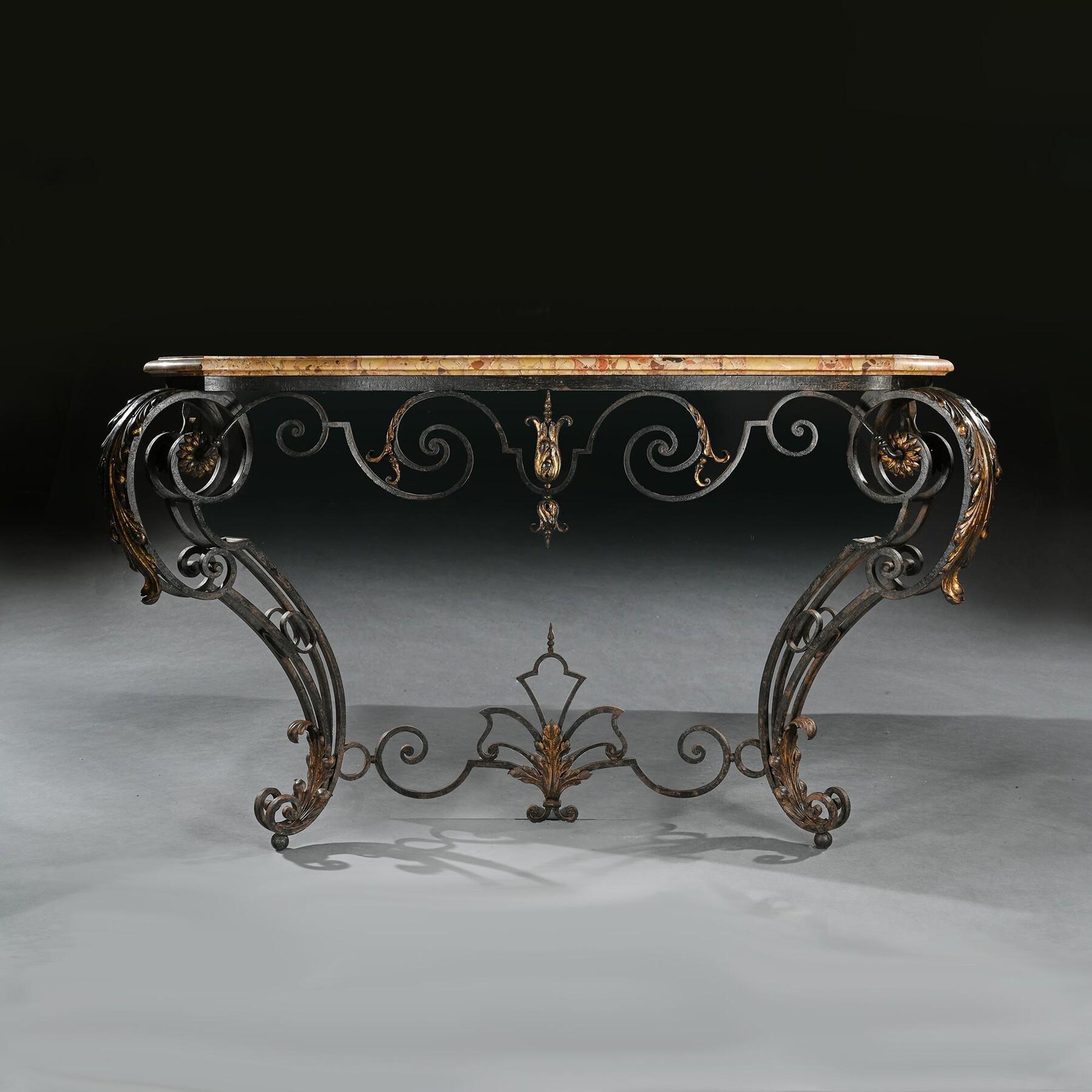 An Extremely Attractive and Imposing French Wrought Iron and Parcel Gilt Console Table With Original Brèche d’Alep Marble Top

French circa 1880

Of grand scale, this console table is of particularly well-proportioned slim form, the body of the