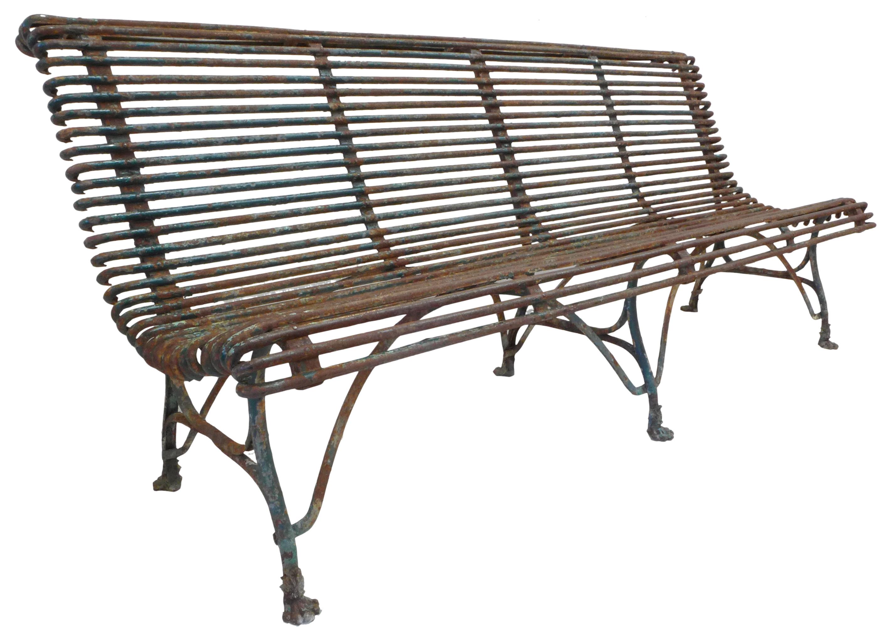 A fantastic mid-19th century French Arras wrought iron garden bench. Standing on claw feet and filled with great curvilinear detail, an armless 4-seat surface with alluring repeating lines. An incredible, untouched surface from many years outdoors;