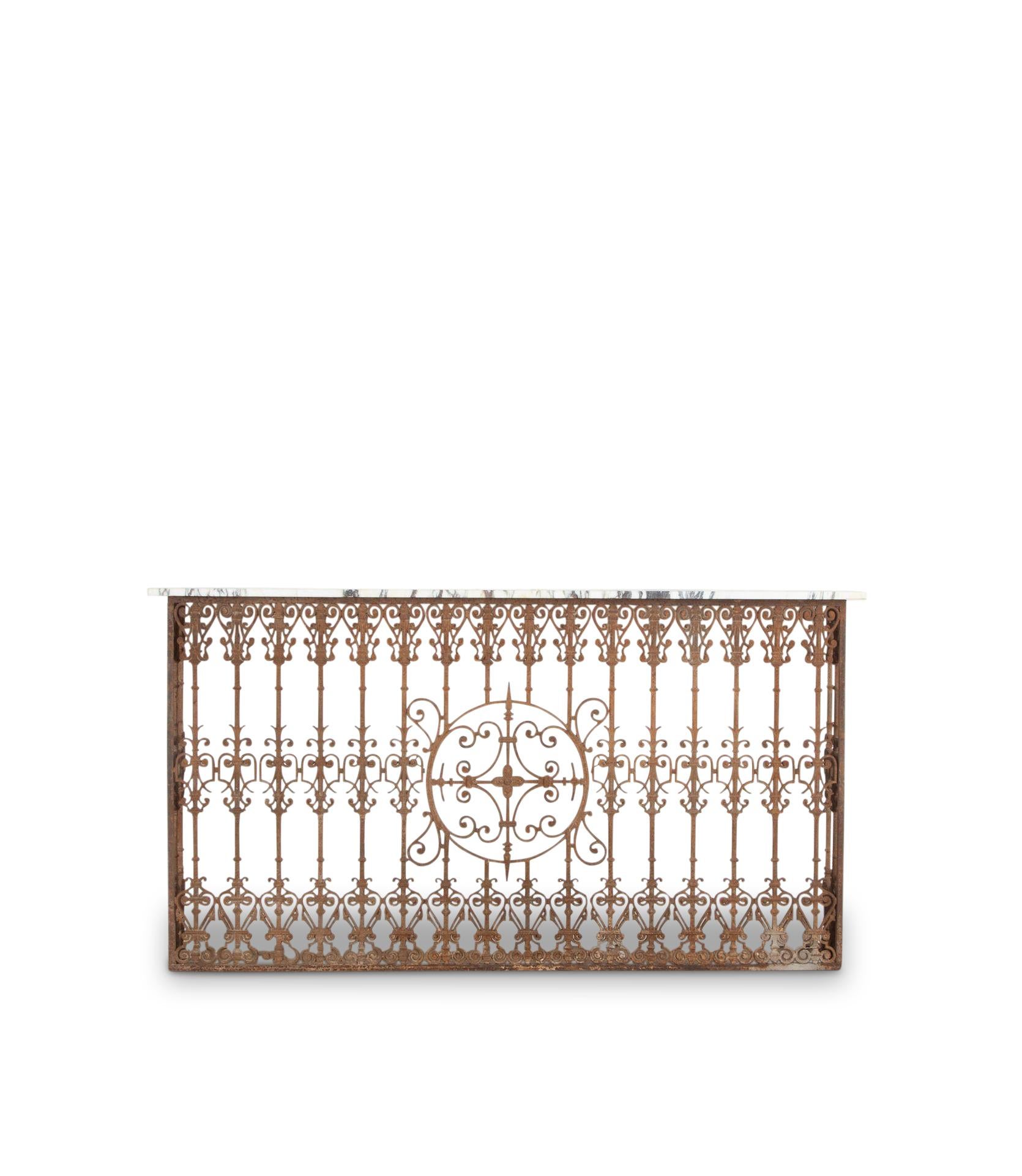 Wonderful French 19th Century wrought Iron Balcony converted into a console/mantle with a piece of deep mauve and white marble. 

Would be a wonderful addition to most rooms or to cover a radiator.