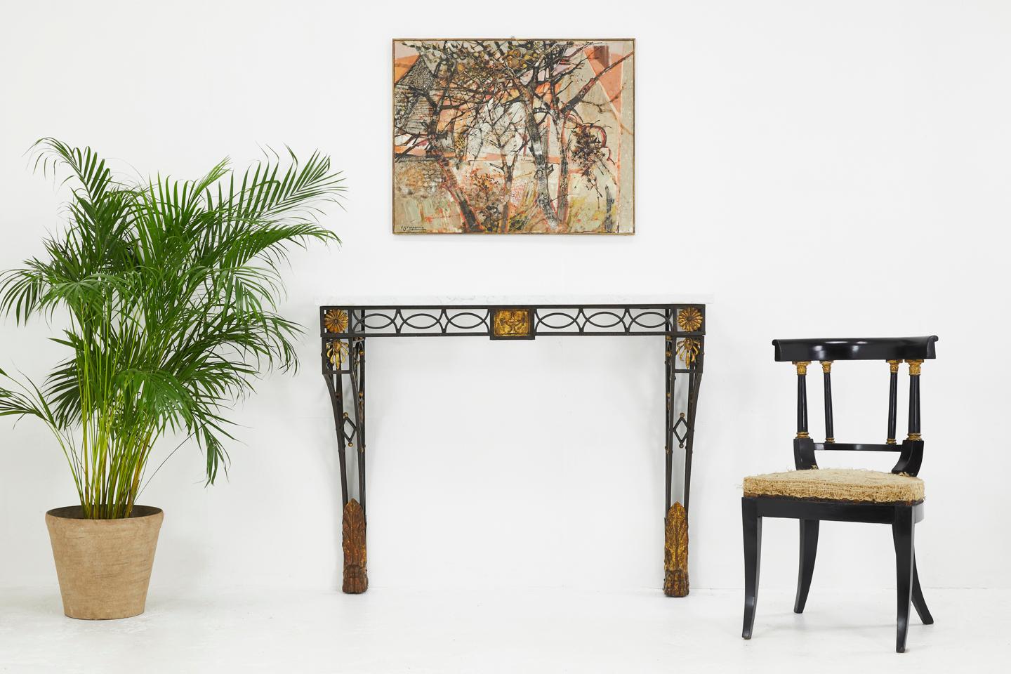 Fantastic quality French 19th century wrought iron console table with gilt metal decoration and white marble top. An unusual model with gilded paw feet.