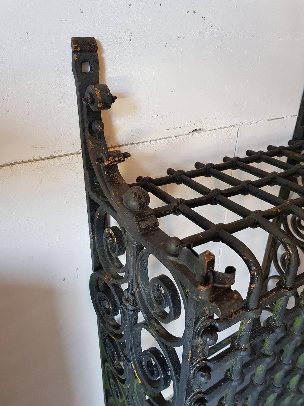 19th century French wrought iron window bars and braided with graceful curls, really a beautiful piece of craftsmanship from the 19th century and it's heavy.

The measurements are:
Depth 30.5 cm/ 12 inch.
Width 52 cm/ 20.4 inch.
Height 87.5 cm/