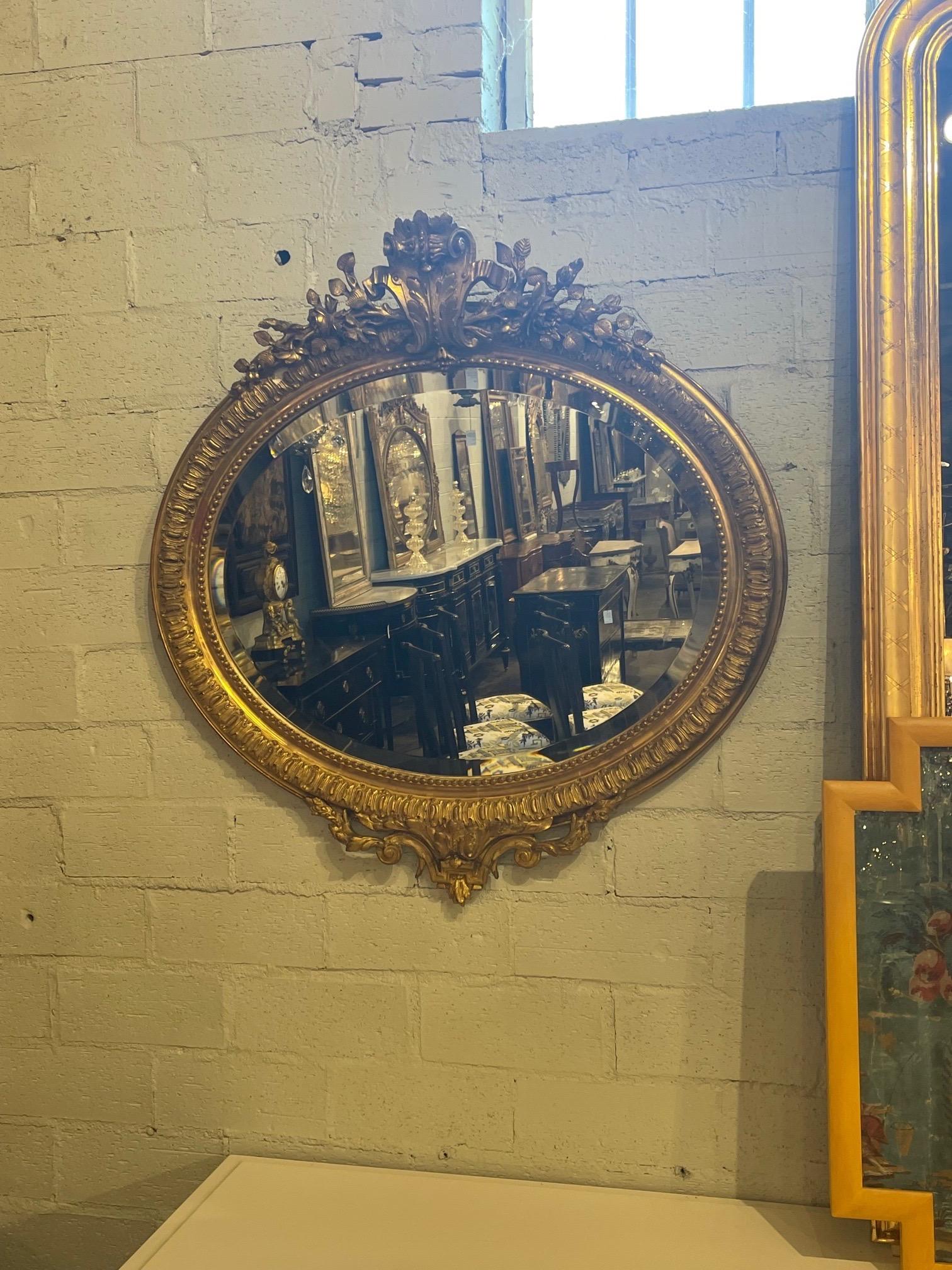Elegant 19th century French XVI oval giltwood mirror. Beautiful carving and nice beveled mirror. A special piece! Note: We have another that is a near match to this mirror.