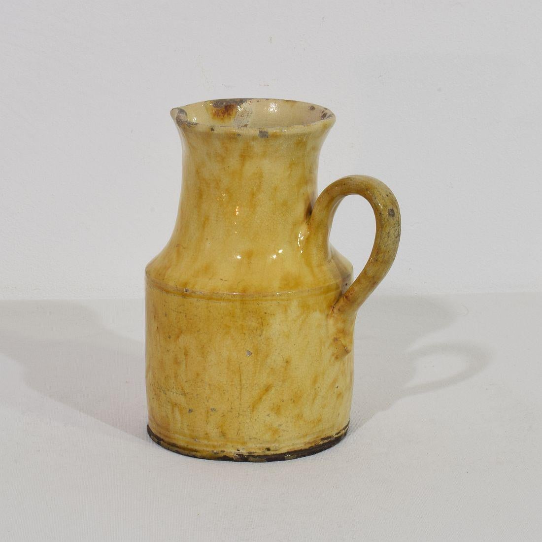 Great authentic and rare piece of pottery from the Provence. Beautiful weathered and an amazing color. Imperfections help authenticate this water cruche as it was an utilitarian type piece. France, circa 1850-1900.