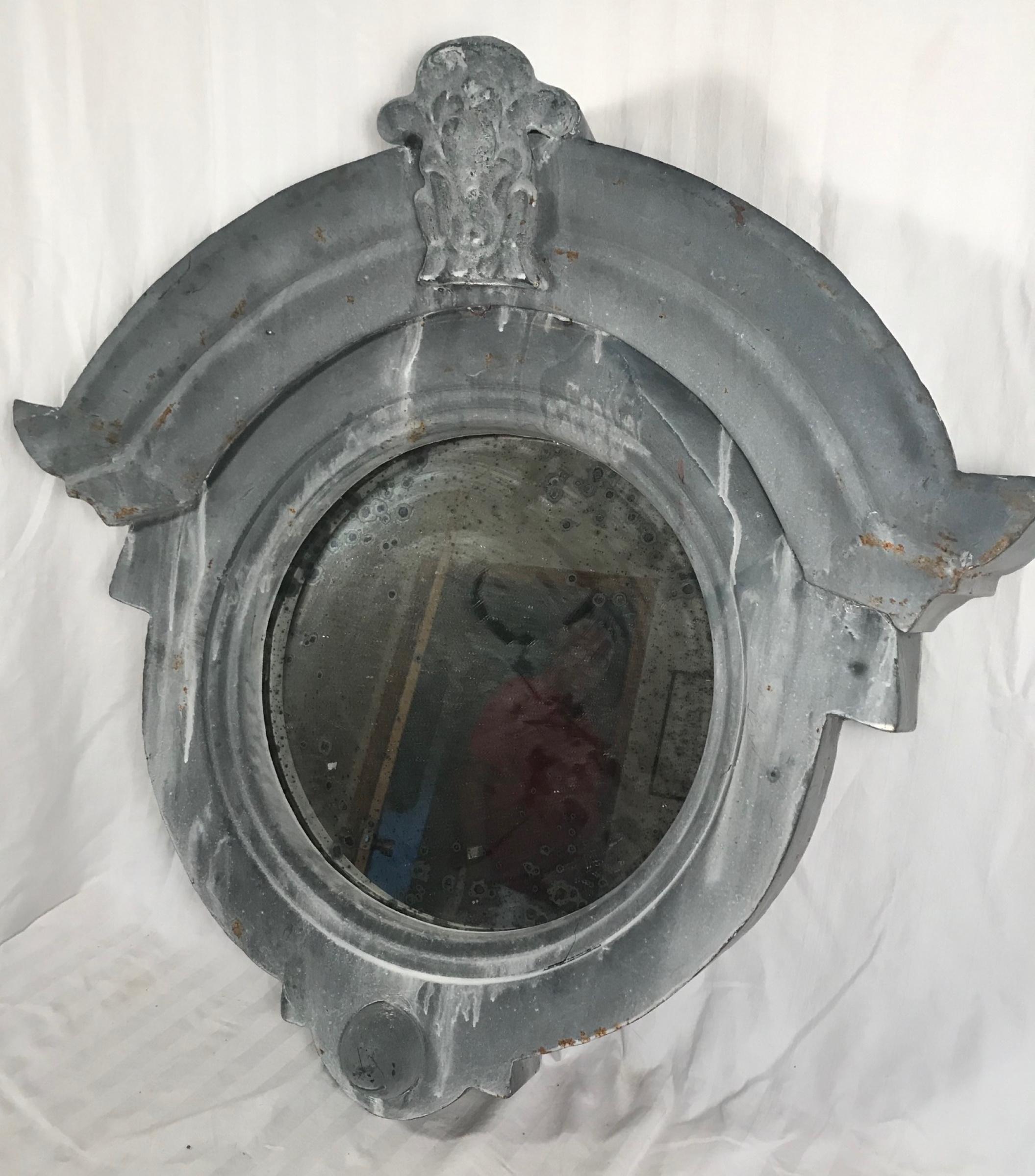 19th century French zinc Oeil De Boeuf, bull’s eye zinc dormer window mirror

This vintage French zinc Oeil De Boeuf dormer window is an architectural salvage element with historic distinction. The majestic windows graces the facades of France’s