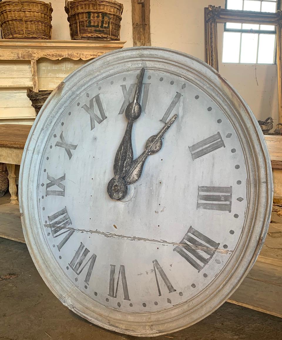 A 19th century zinc tower clock face from a church in the south of France. In nice original condition with original metal hands. It has the name of the church written on the back. 
This is not working and is sold as a decorative piece. 
Please