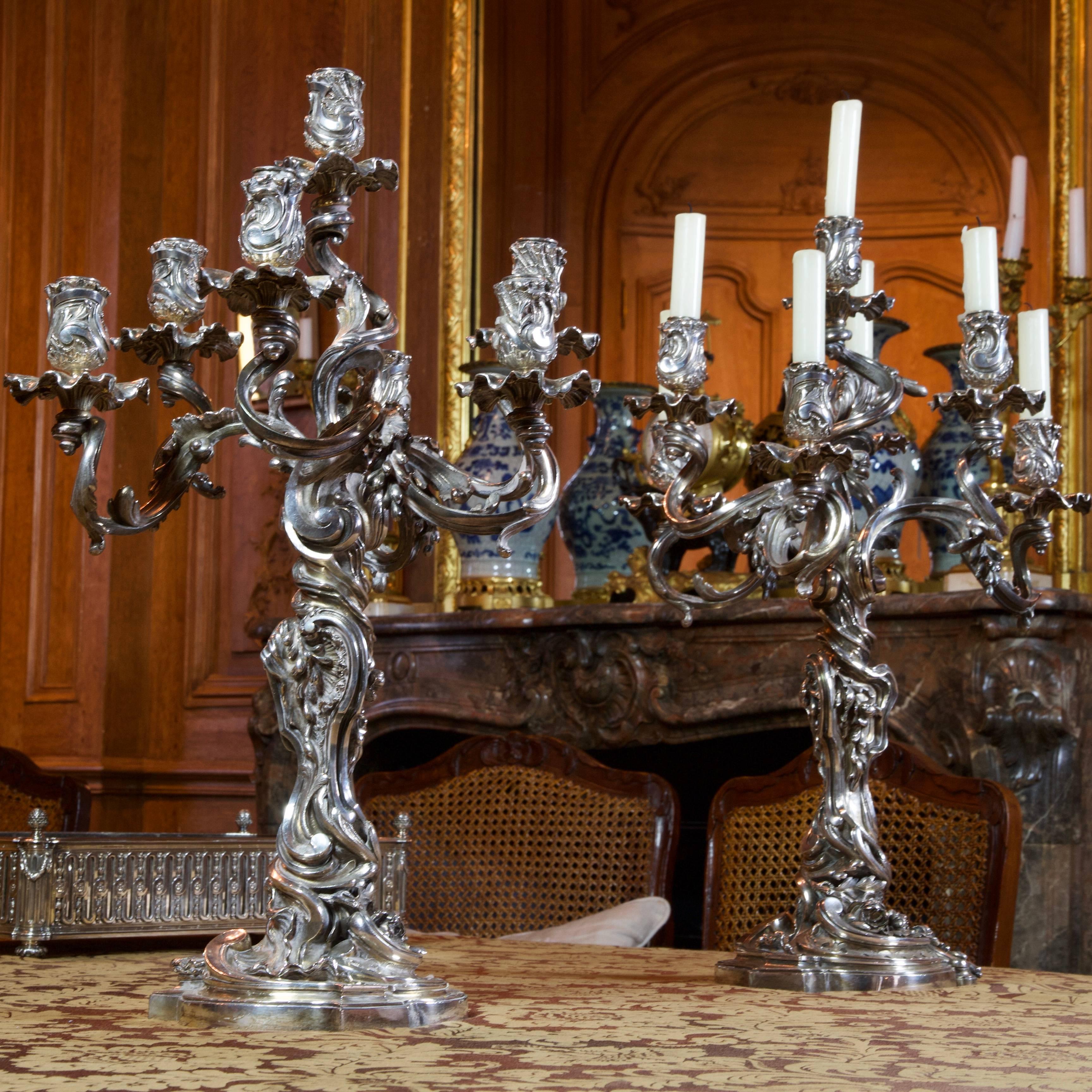Large pair of candelabra with seven lights. Bronze silvered. Totally decorated with scrolls, flowers, guirlands, enroulements, in pure style of Rococo.
Signed Froment-Meurice on the base. Froment-Meurice was a great silversmith in Paris in 19th
