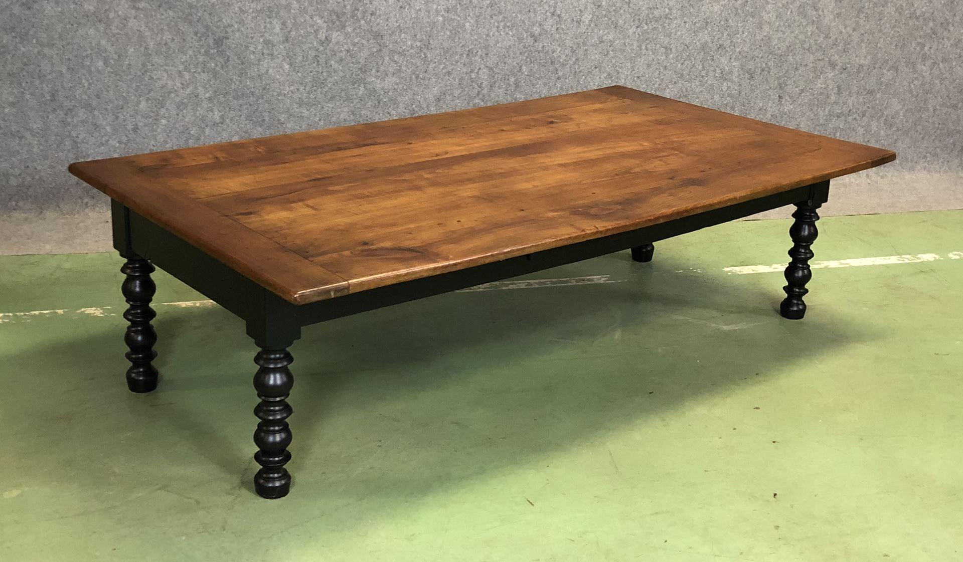 19th century fruitwood coffee table with black foot painted.