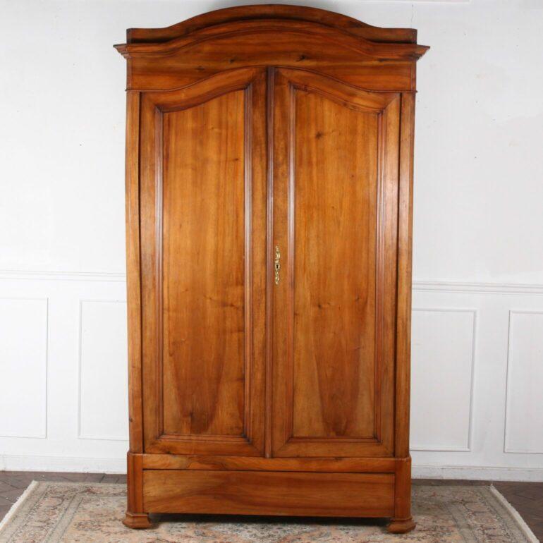 Beautiful patination on the 'Gens D'Armes' Style 19th century Walnut Armoire from France. Great for storage and clothes.