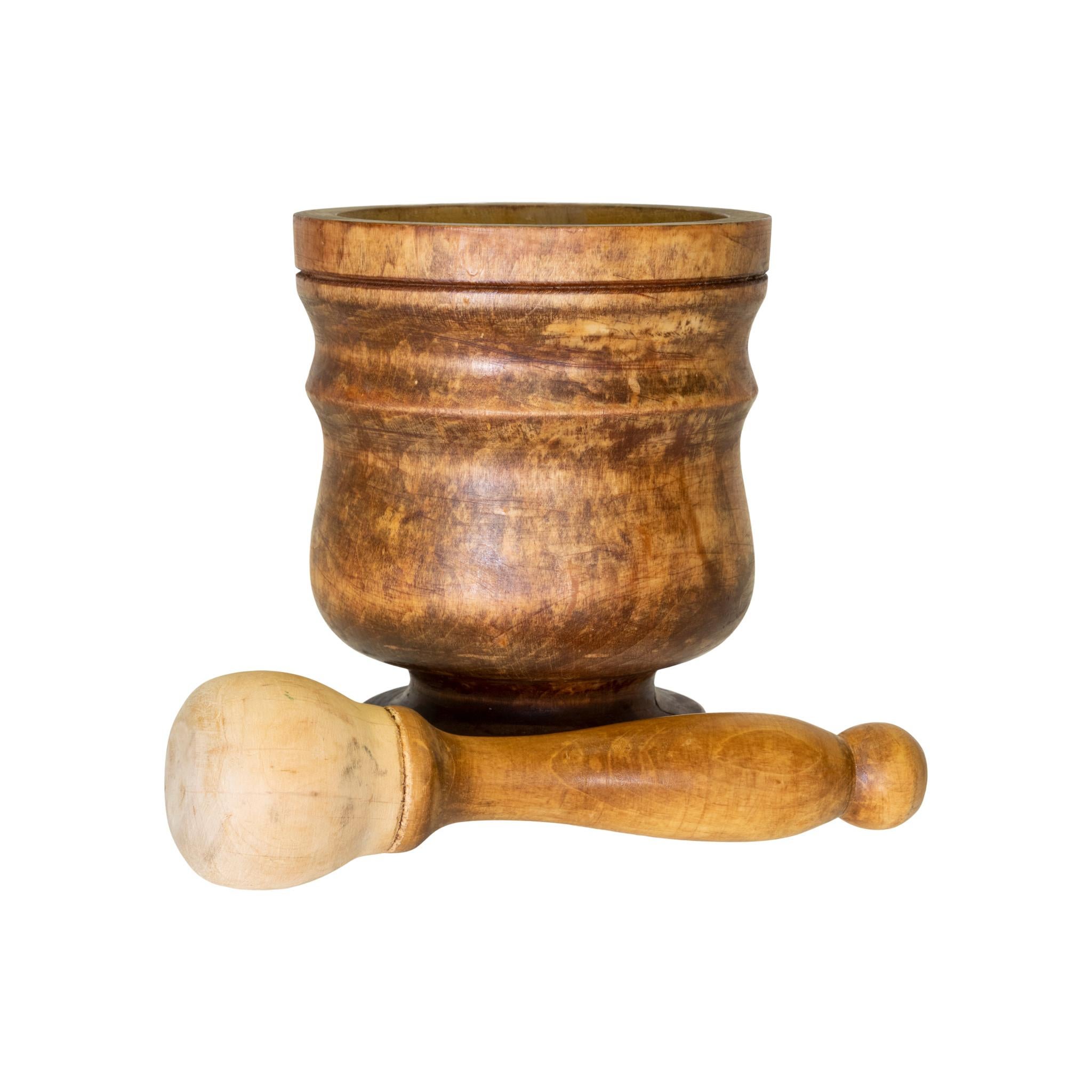19th century fruitwood mortar and pestle. Lathe work, remnants of paint or dark stain. Original pestle included.

Period: First half of the 19th century
Origin: Eastern, US
Size: 5