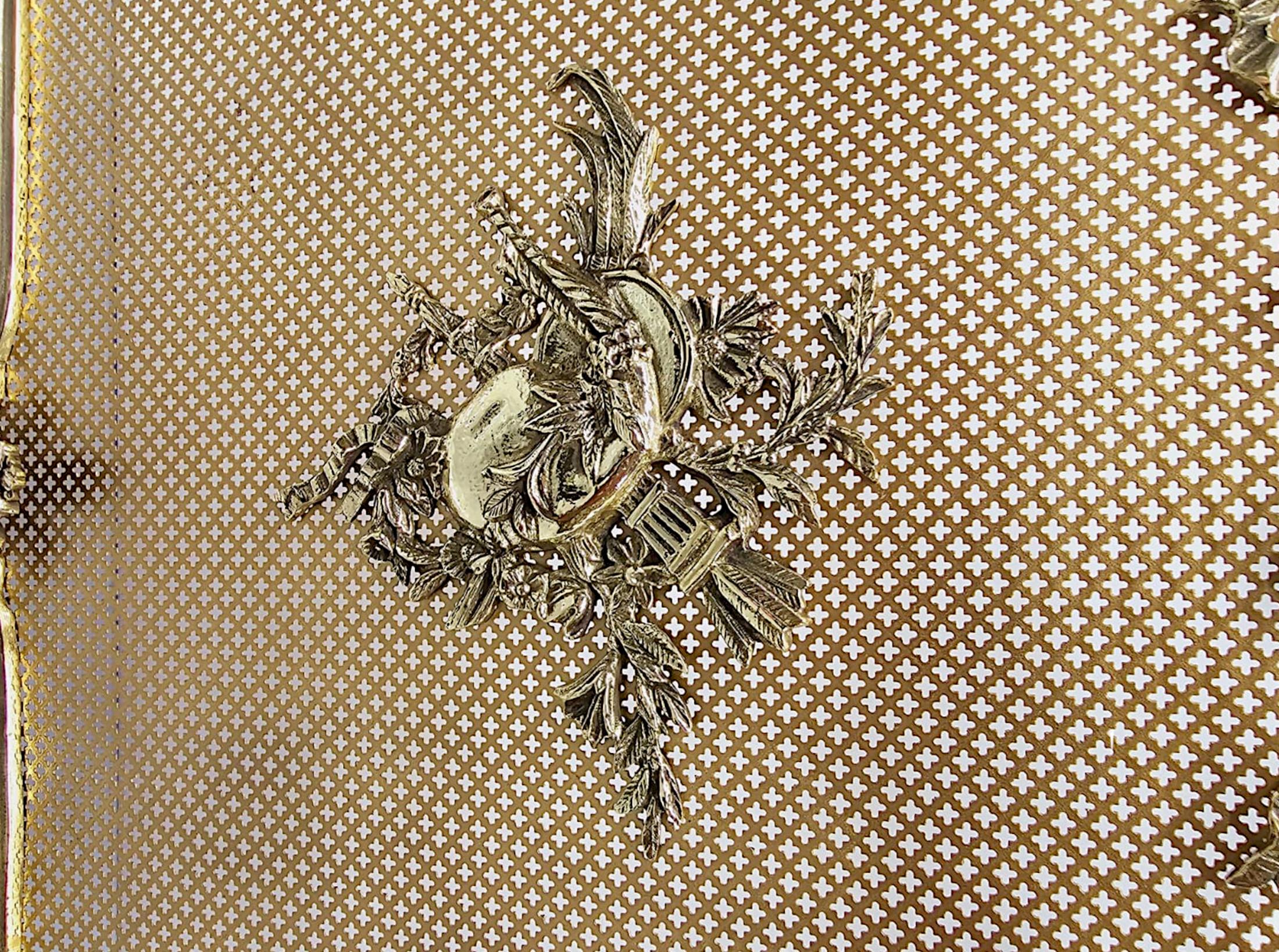 A very fine 19th Century brass fire screen, fully restored and of exceptional quality.  The protective wire mesh of shaped, rectangular form is set within a stunningly detailed polished, cast brass frame with beautiful Neoclassical motifs throughout
