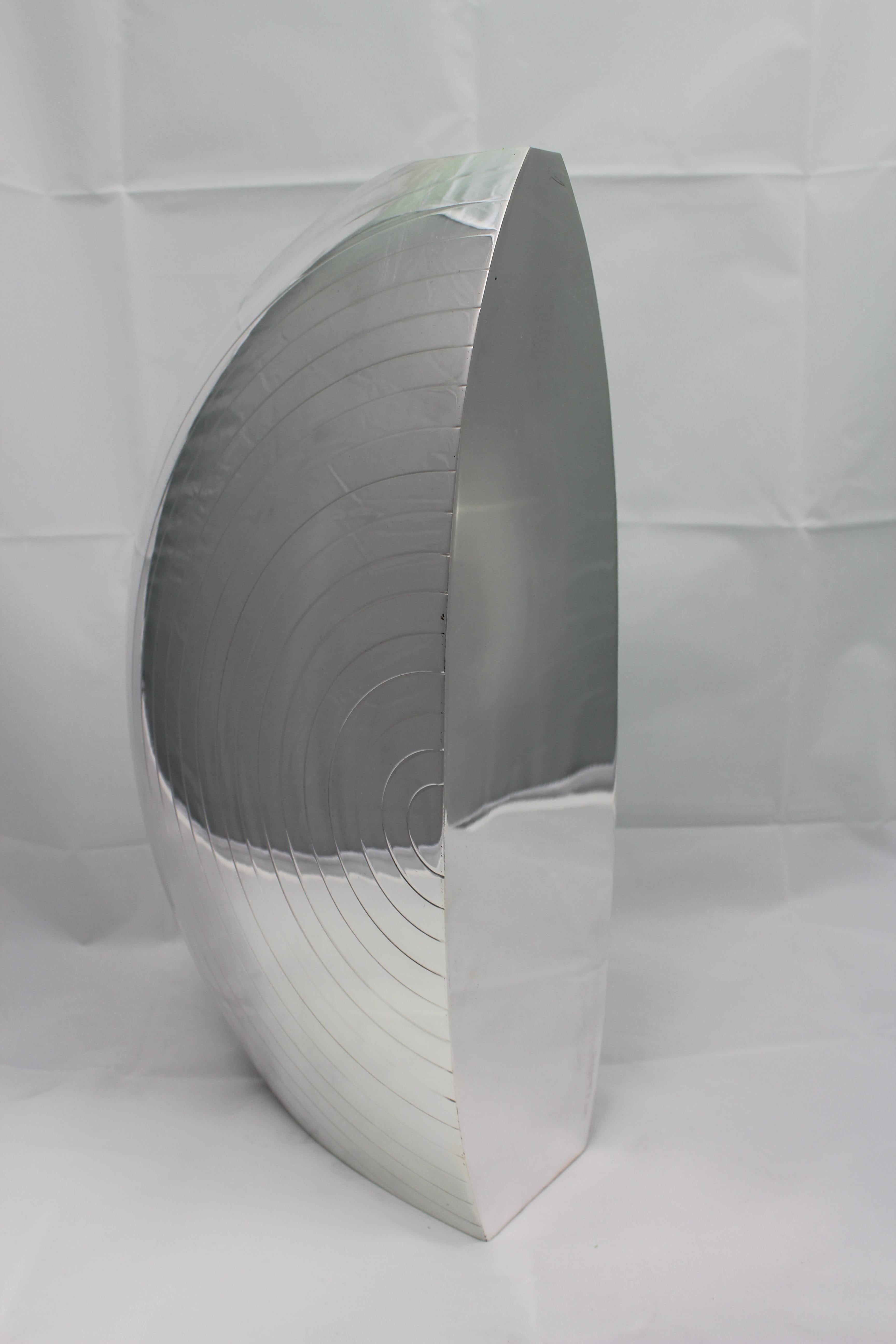 Wonderful futurist vase realized circa 1920s in Milan, Italy, by the silversmith Luigi Diani.

Sail shaped and decorated with circular lines on both large sides. The third side is completely smooth. 

Unique design and model derived from